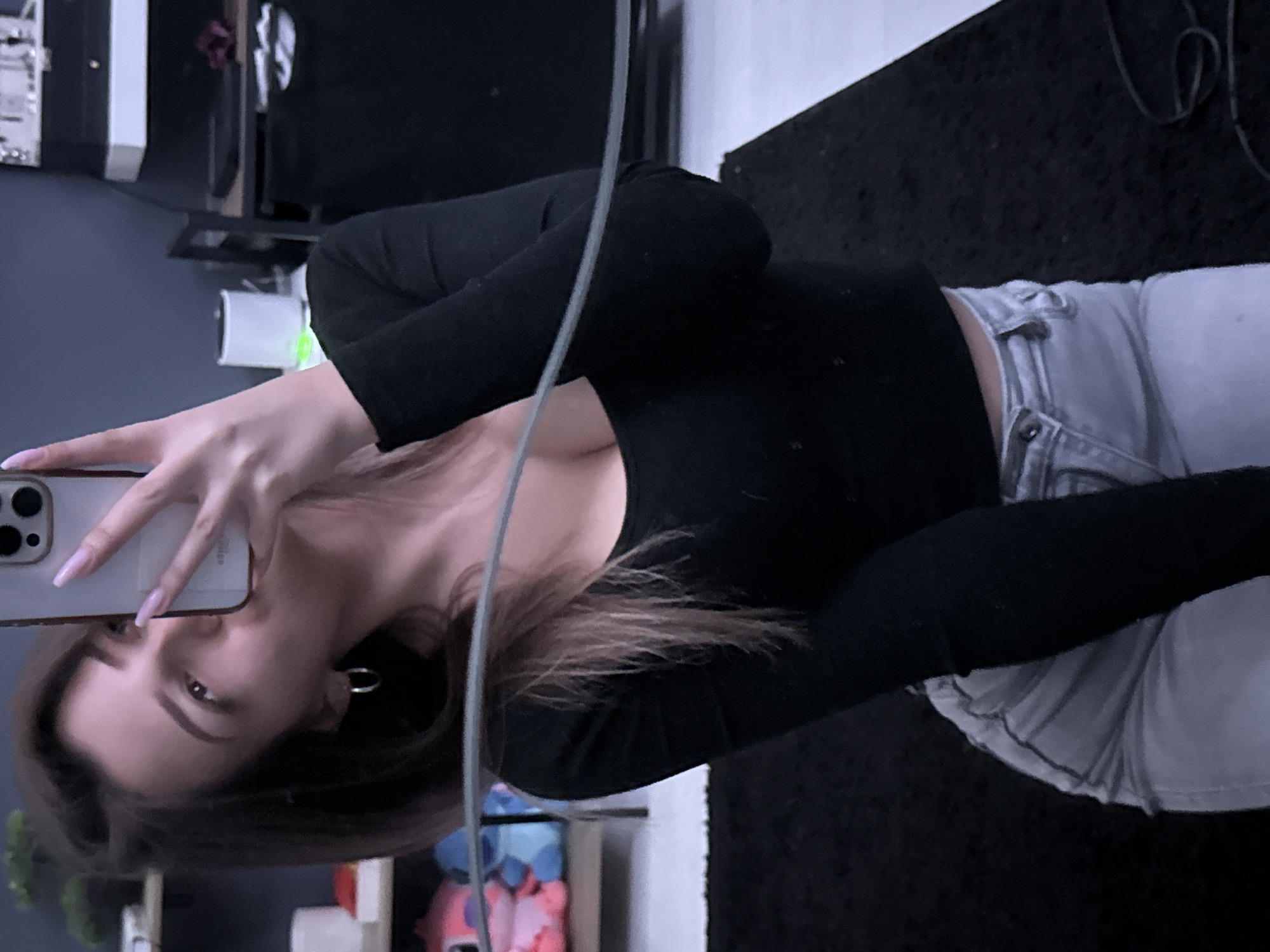 Woman takes selfies in Sofia apartment room