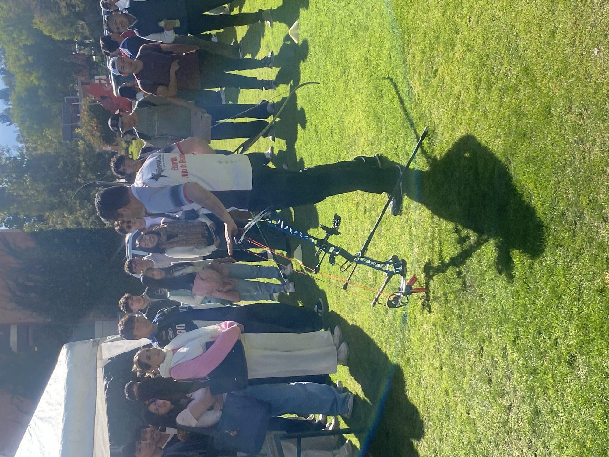 Archery instructor teaches young people bow techniques in Bolivia