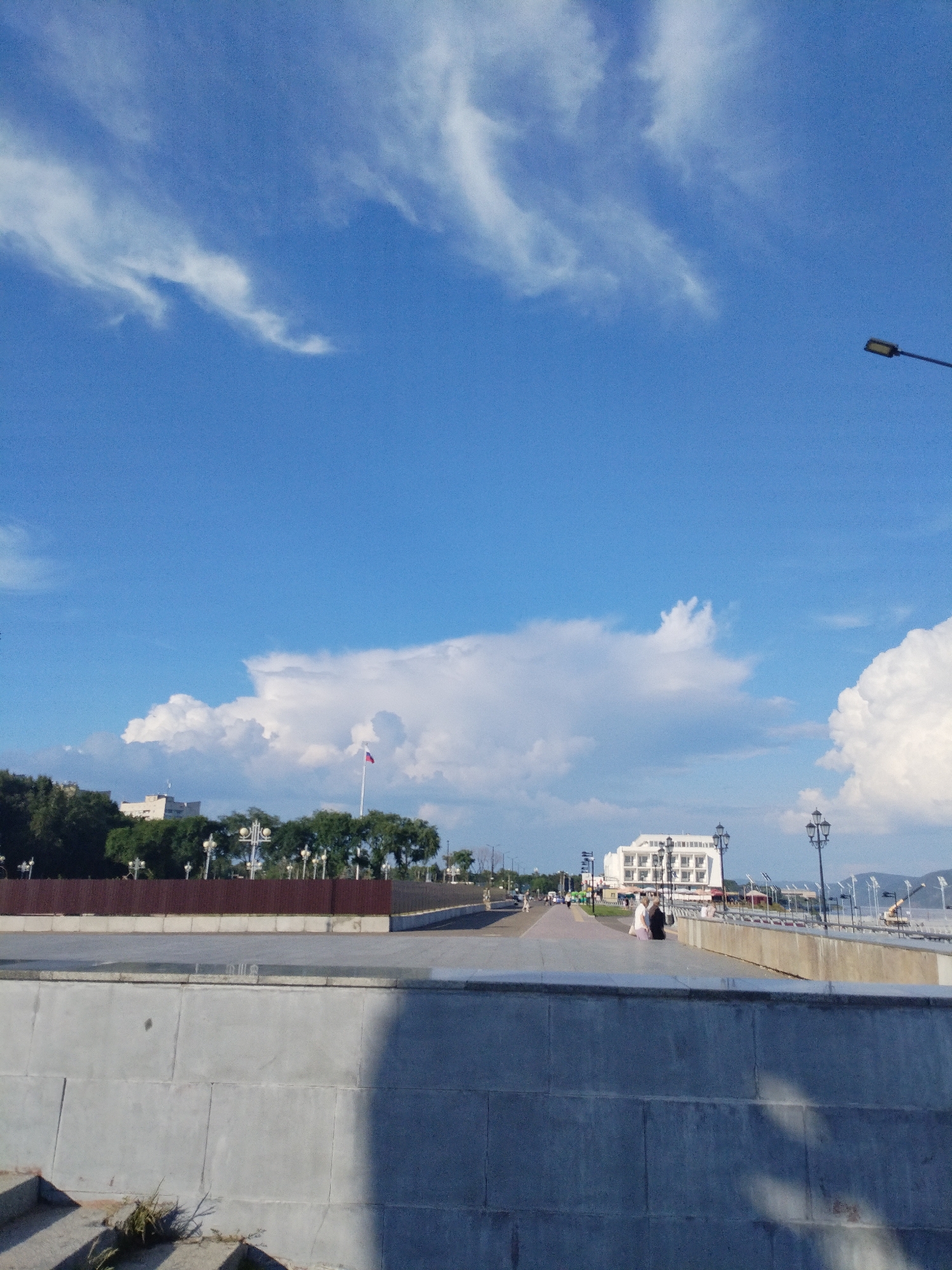 Sunny morning stroll along the Amur River promenade