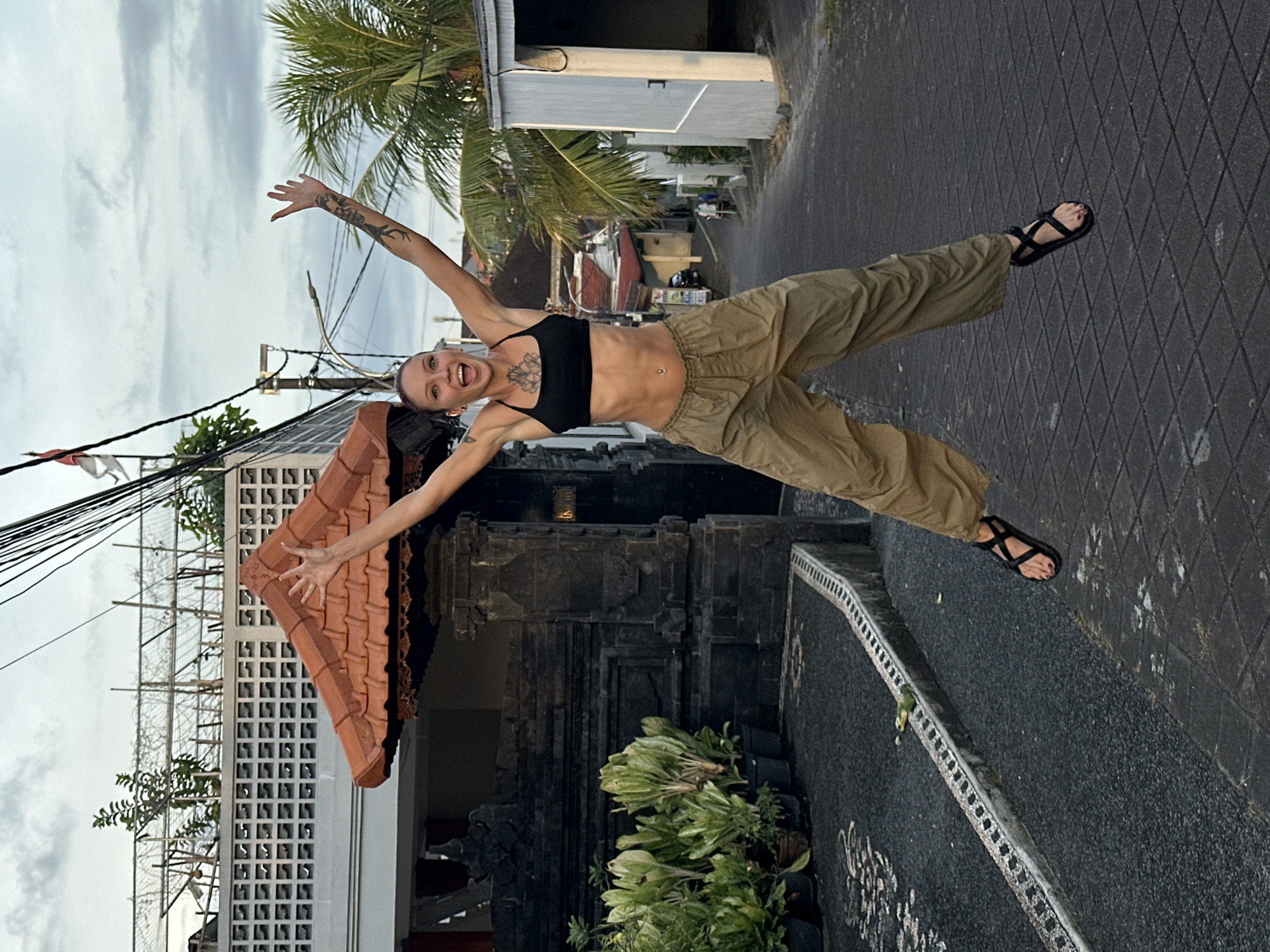 Tourist photo session captured on Dalung streets with local architecture
