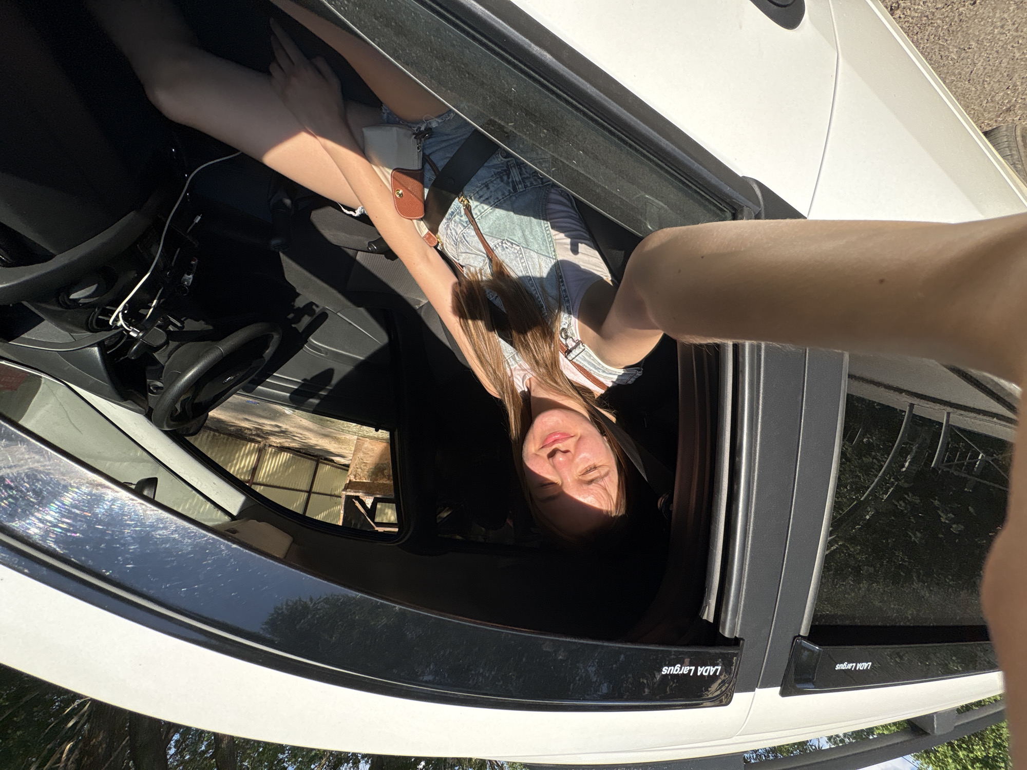 Woman takes car selfies in Perm, Russia