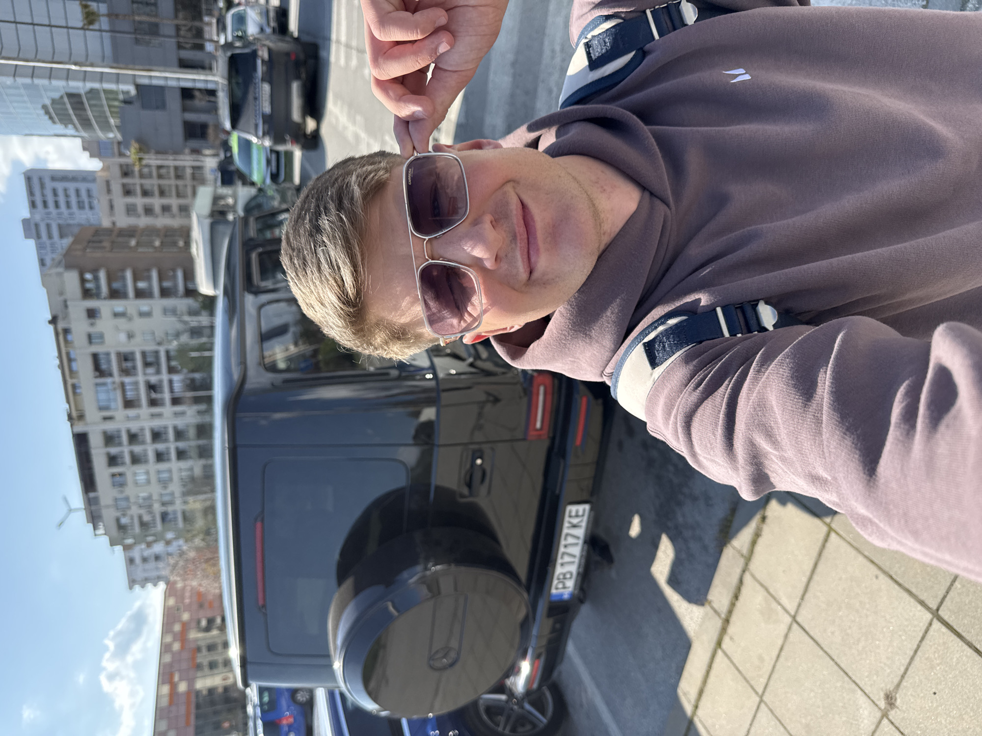Man takes selfies, eats meal near luxury SUV in Plovdiv