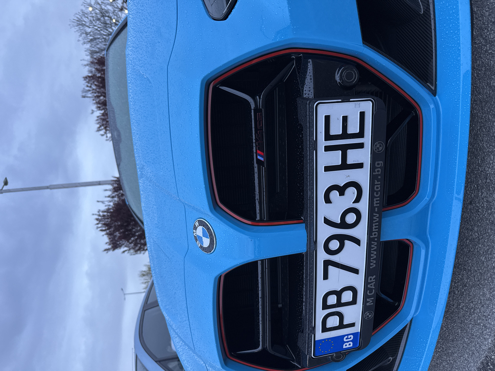 Young man poses with BMW for selfies in Plovdiv