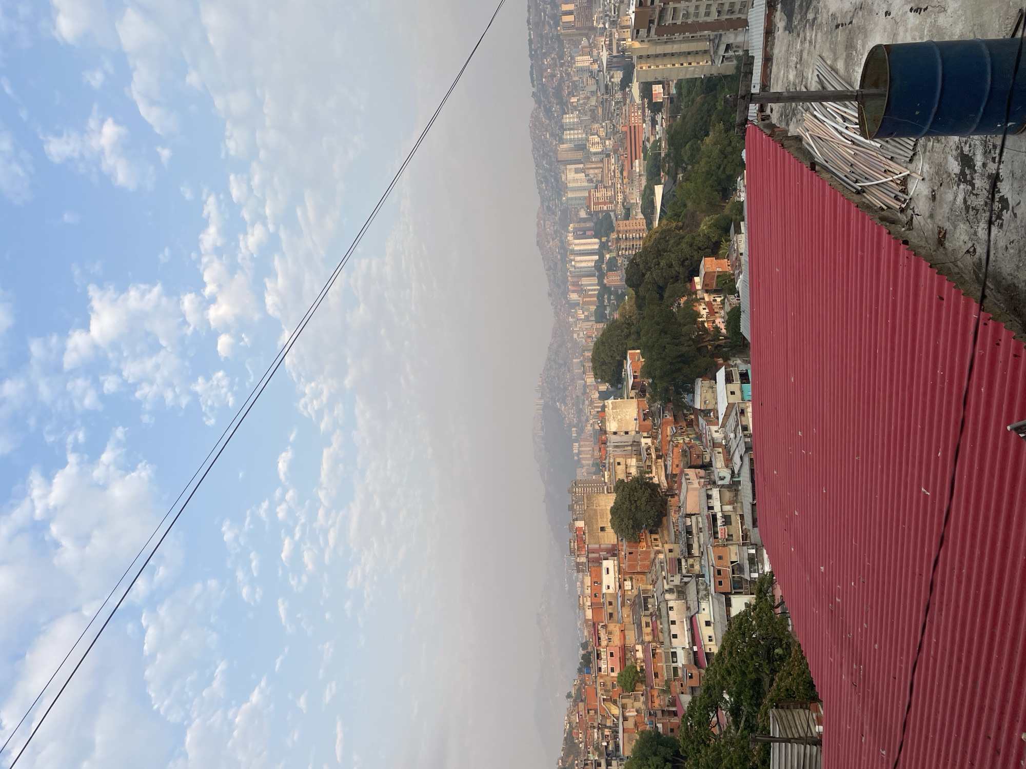 Rooftop scene captured in Caracas with fluorescent tubes visible