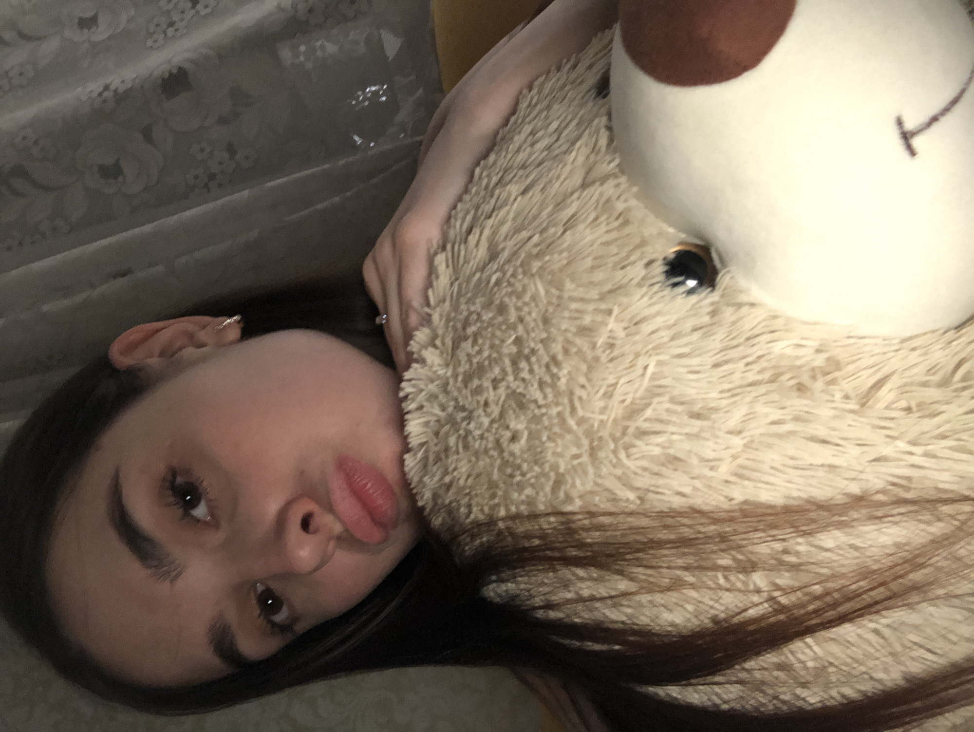 Woman takes bathroom selfies while cat poses nearby