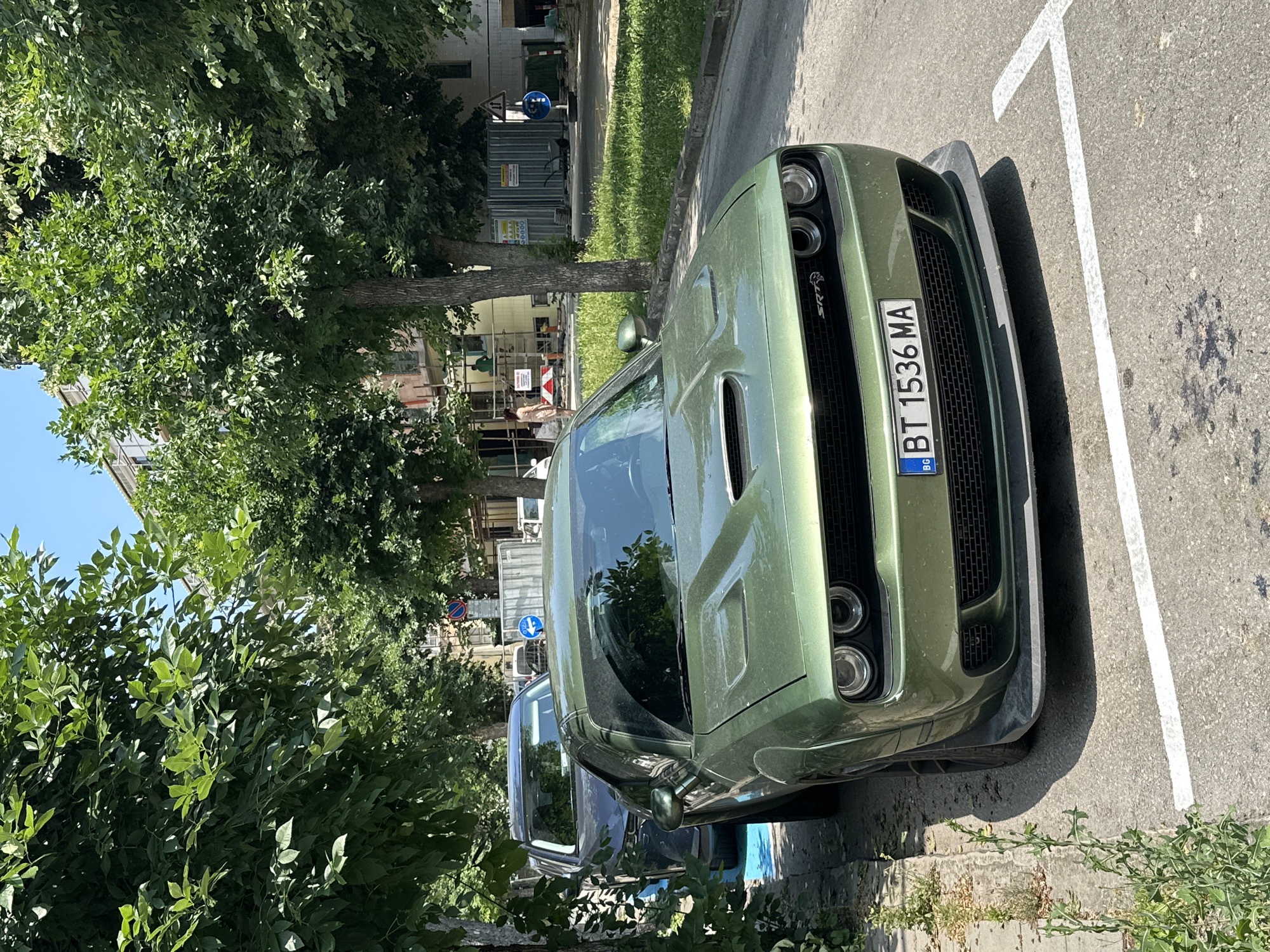 Green Dodge Challenger SRT parked in Veliko Tarnovo, Bulgaria