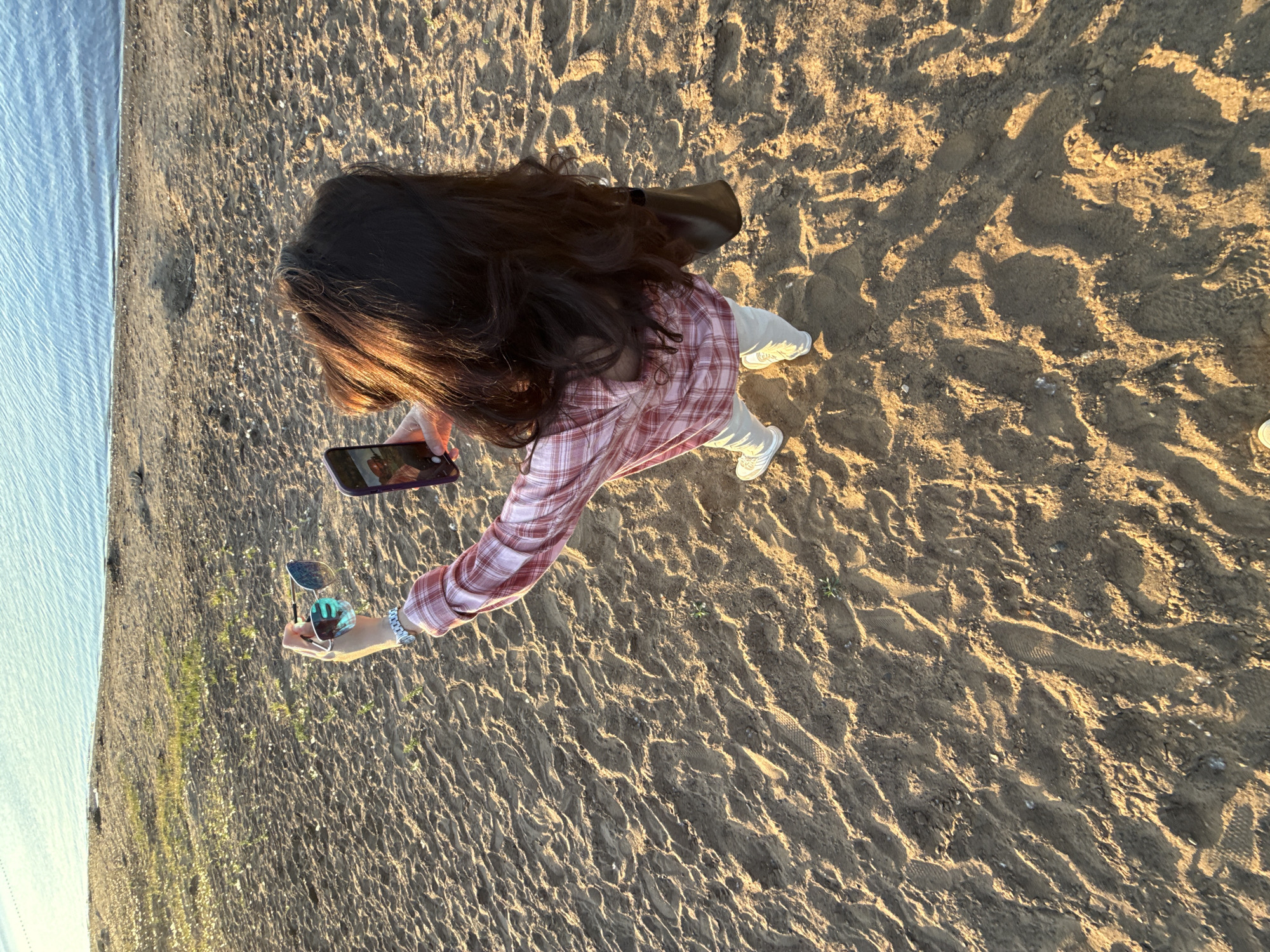 Woman photographed on sandy beach in Chaikovsky, Russia