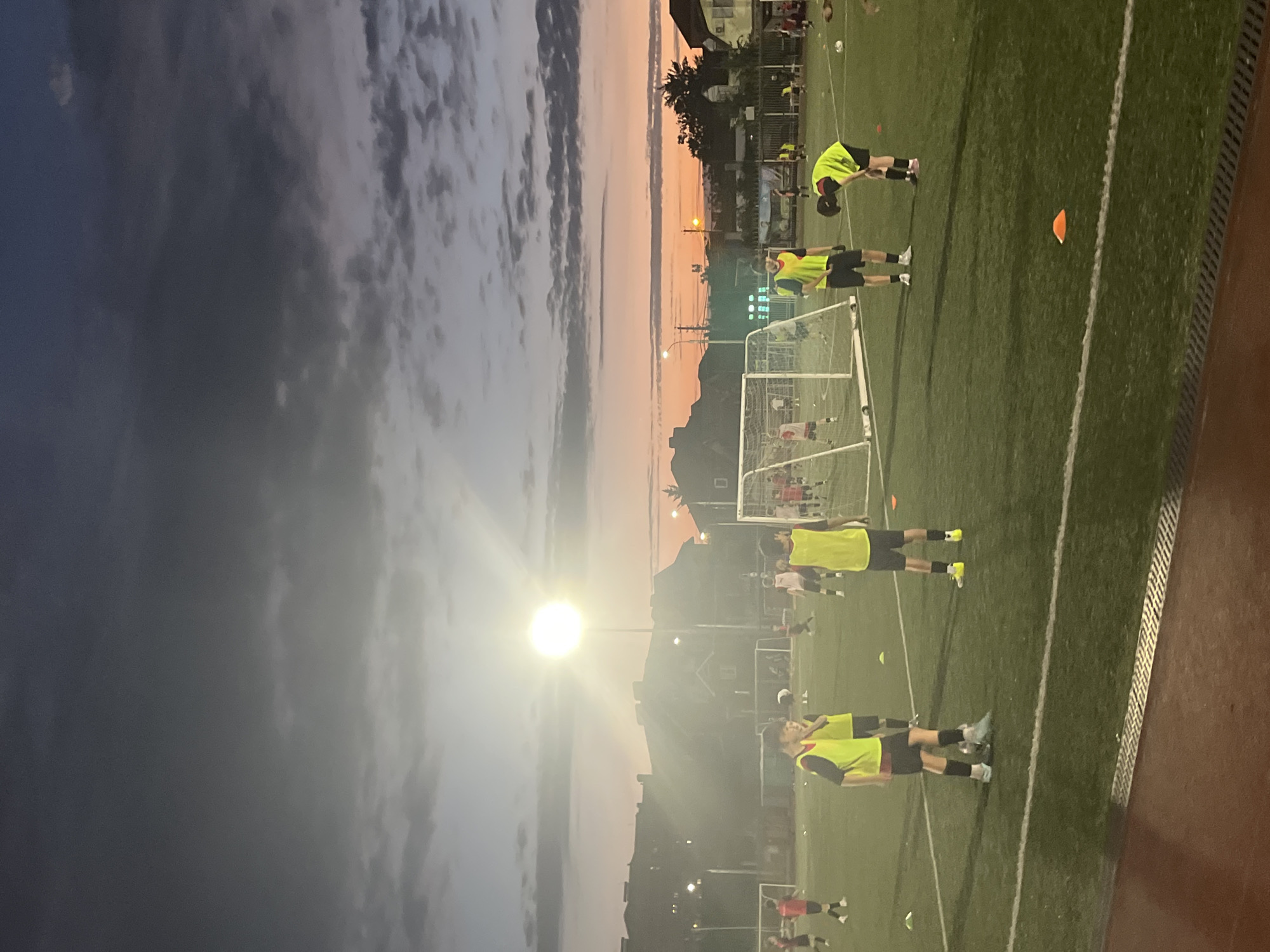 Youth soccer under the lights at dusk in Krasnodar