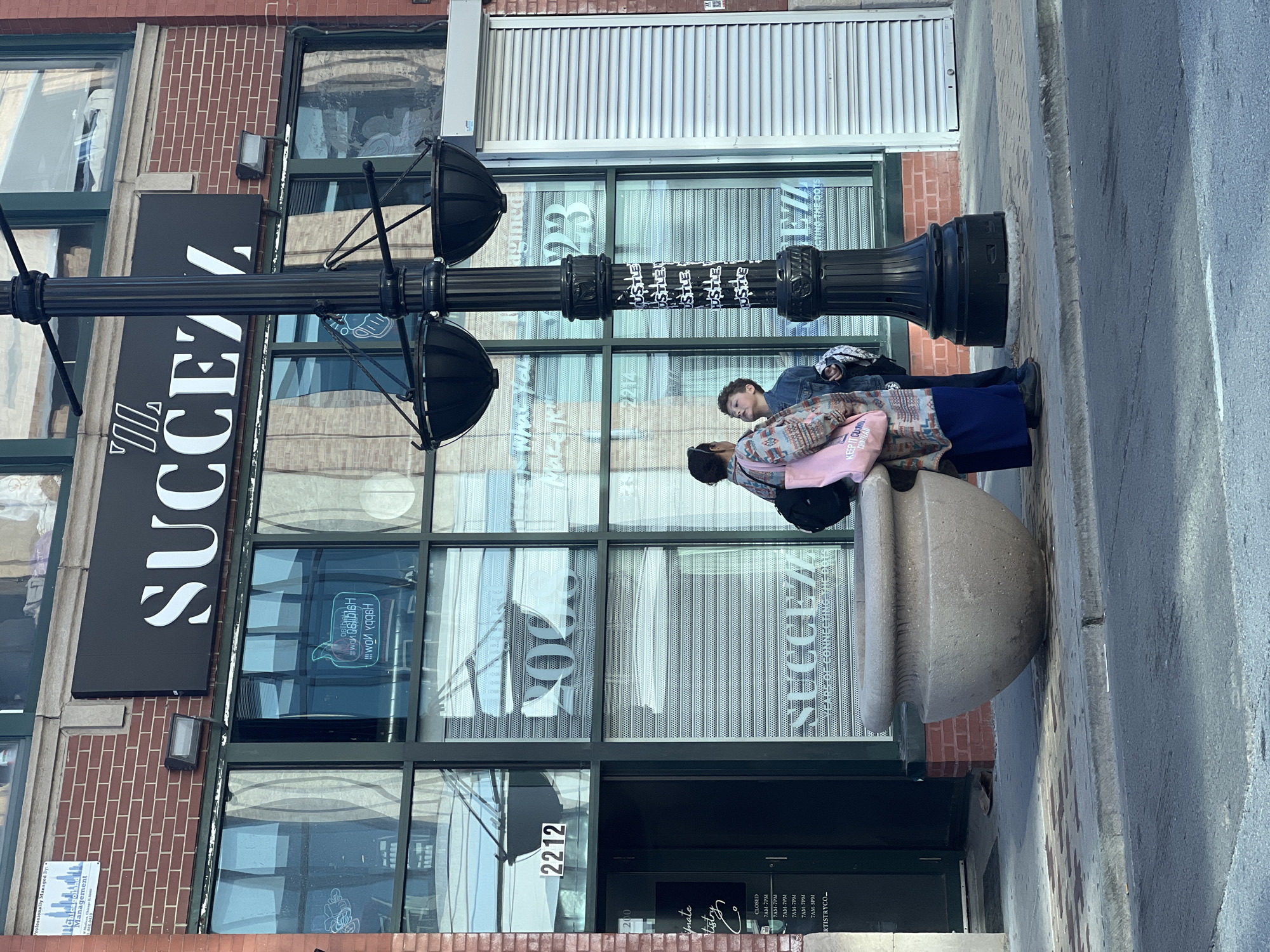 Chicago building with 'SUCCEZZ' signage documented in evening street scene