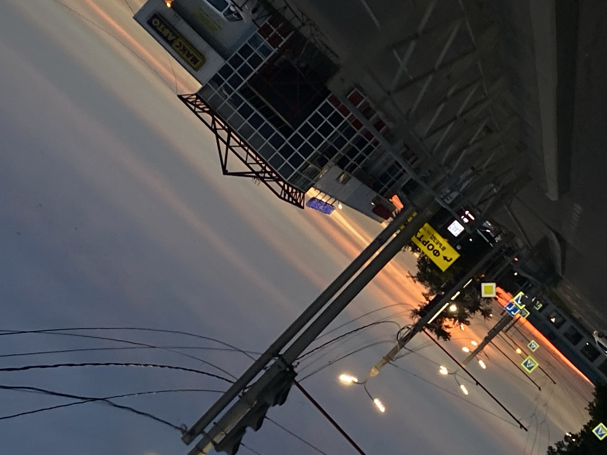 Dusk in Irkutsk: parking lots, odd storefronts, good sky