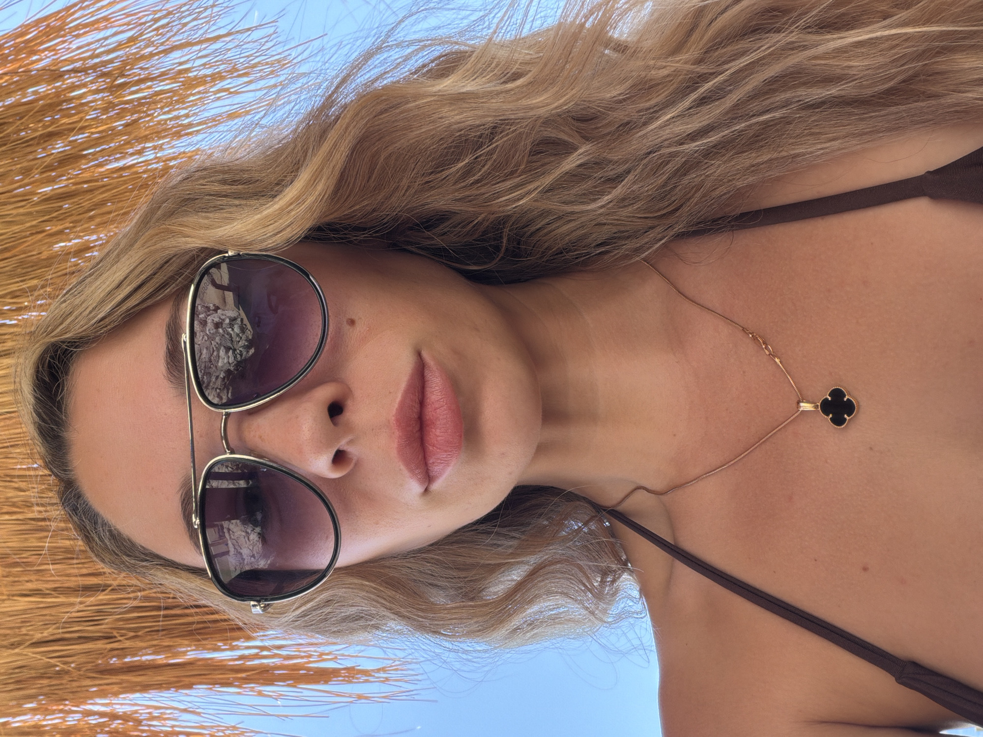 Red Sea resort day: pier, dive boats, and beach loungers in Sharm El Sheikh