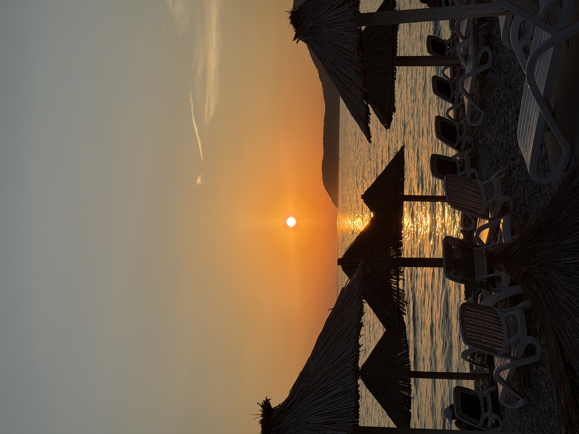 Empty beach chairs at sunset on Montenegro's Adriatic coast