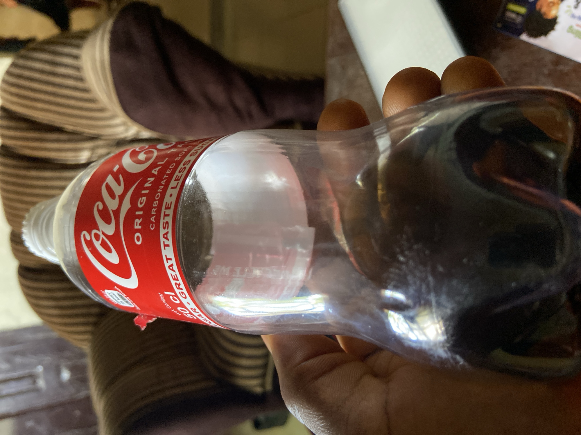 Children play soccer, drink Coke in Mararaba, Nigeria Sunday afternoon