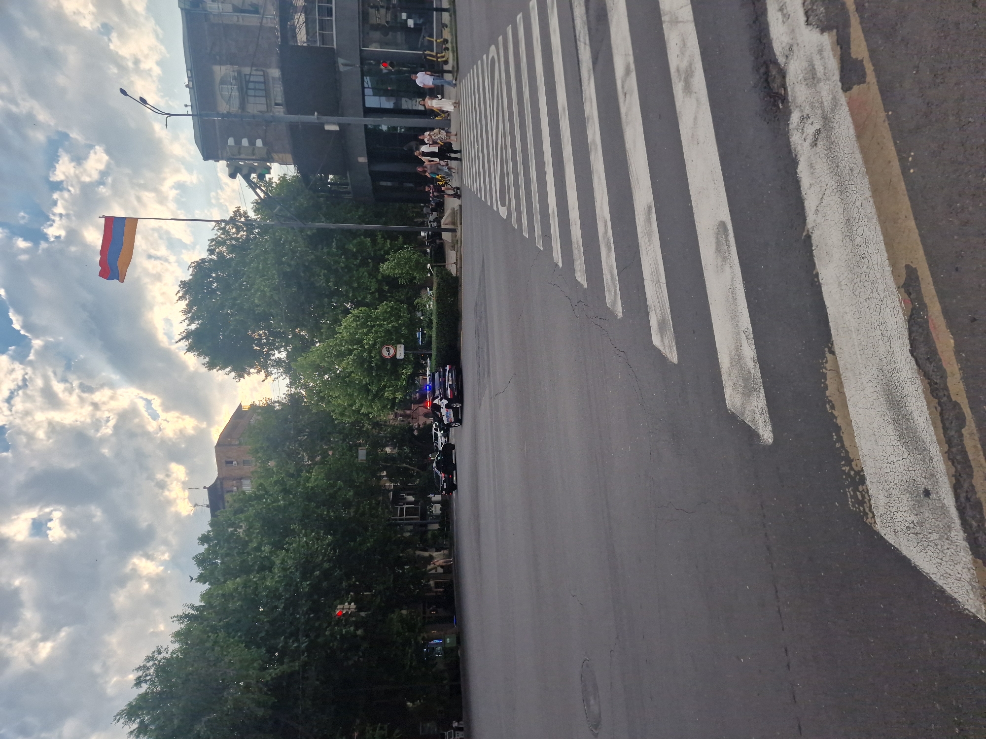 Street-level view of a Yerevan intersection on a cloudy afternoon