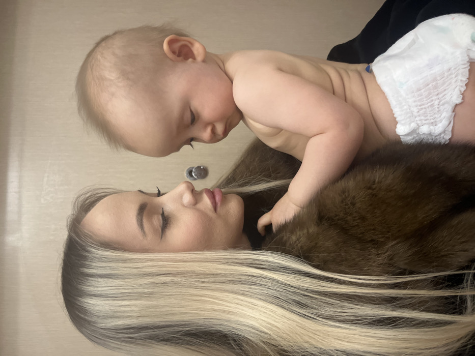 Mother and baby share tender moments in Khimki home