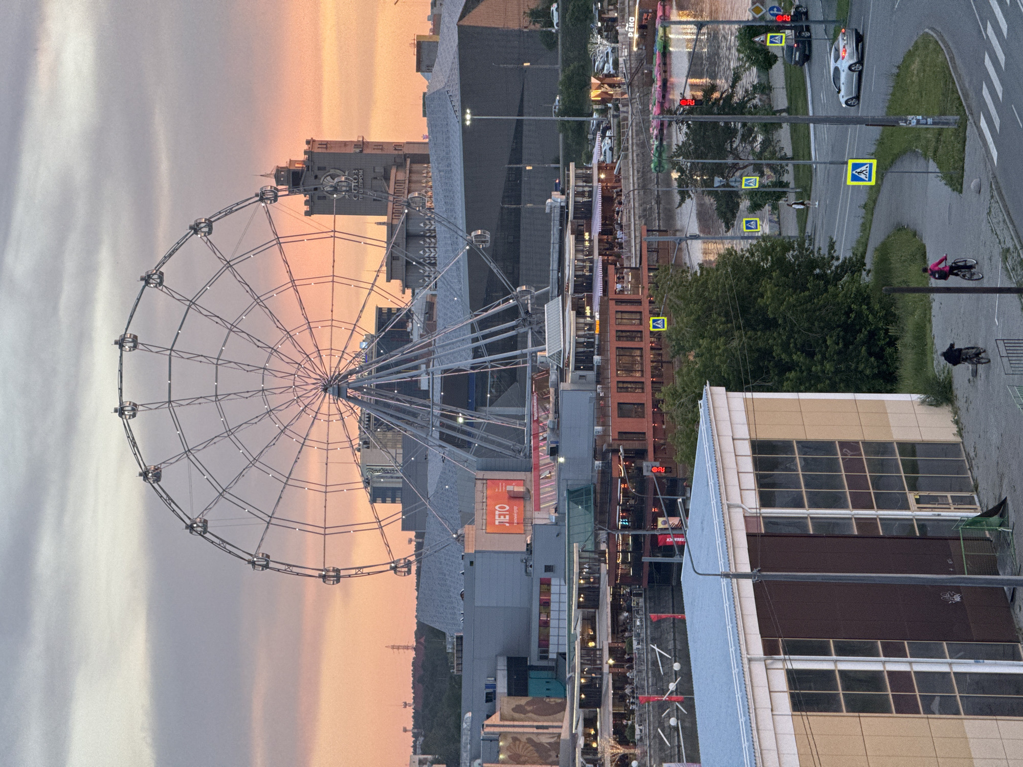Sunset captured over Chelyabinsk cityscape along Miass River