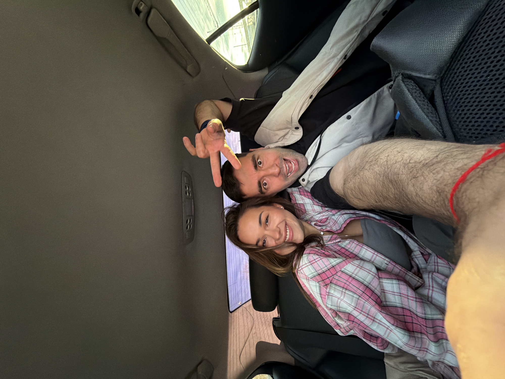 Couple shares playful moment in car backseat in Krasnoyarsk