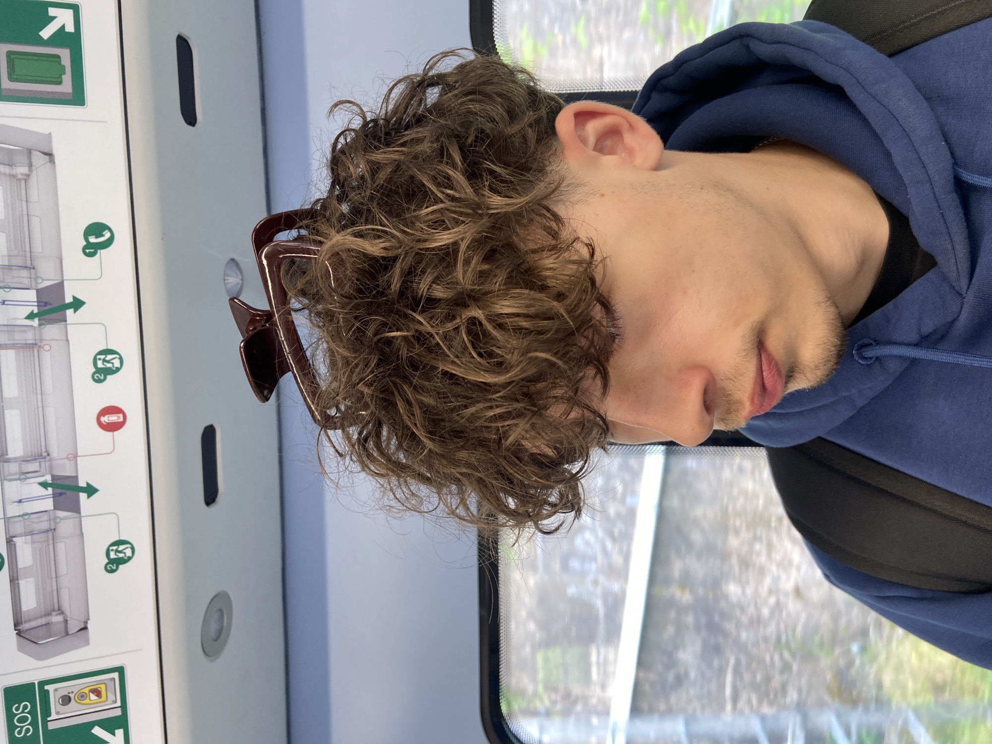 Commuter in blue hoodie observed on London public transport