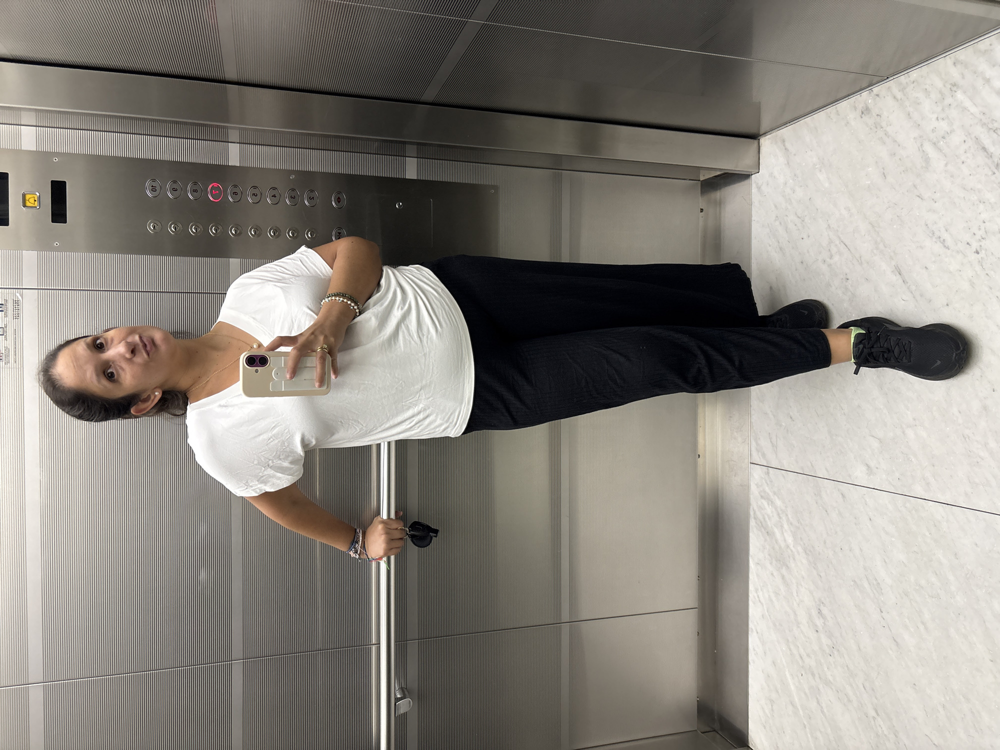 Woman takes elevator selfie in San Isidro, Peru