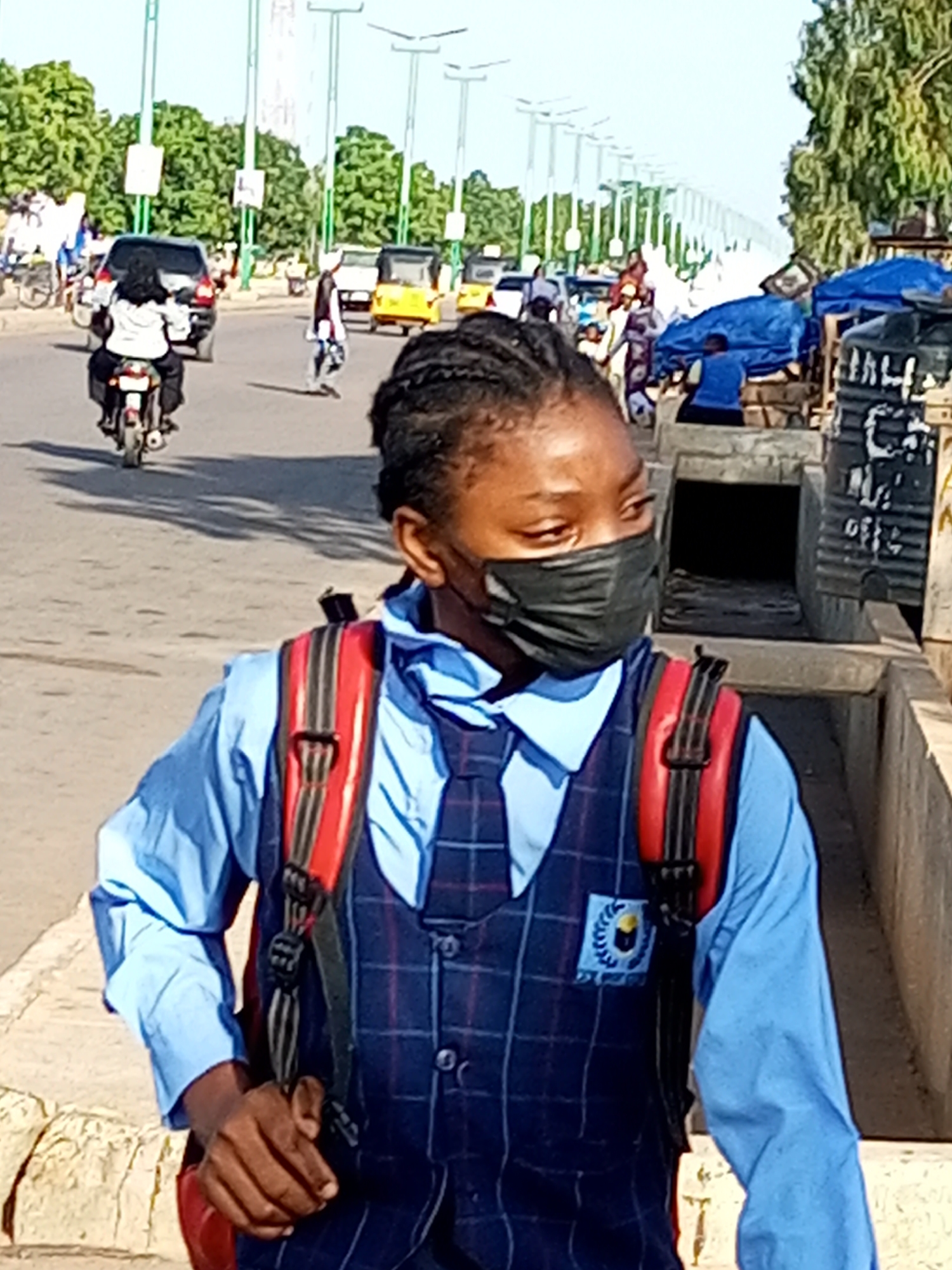 Morning street life across two Nigerian towns, students and vendors out early