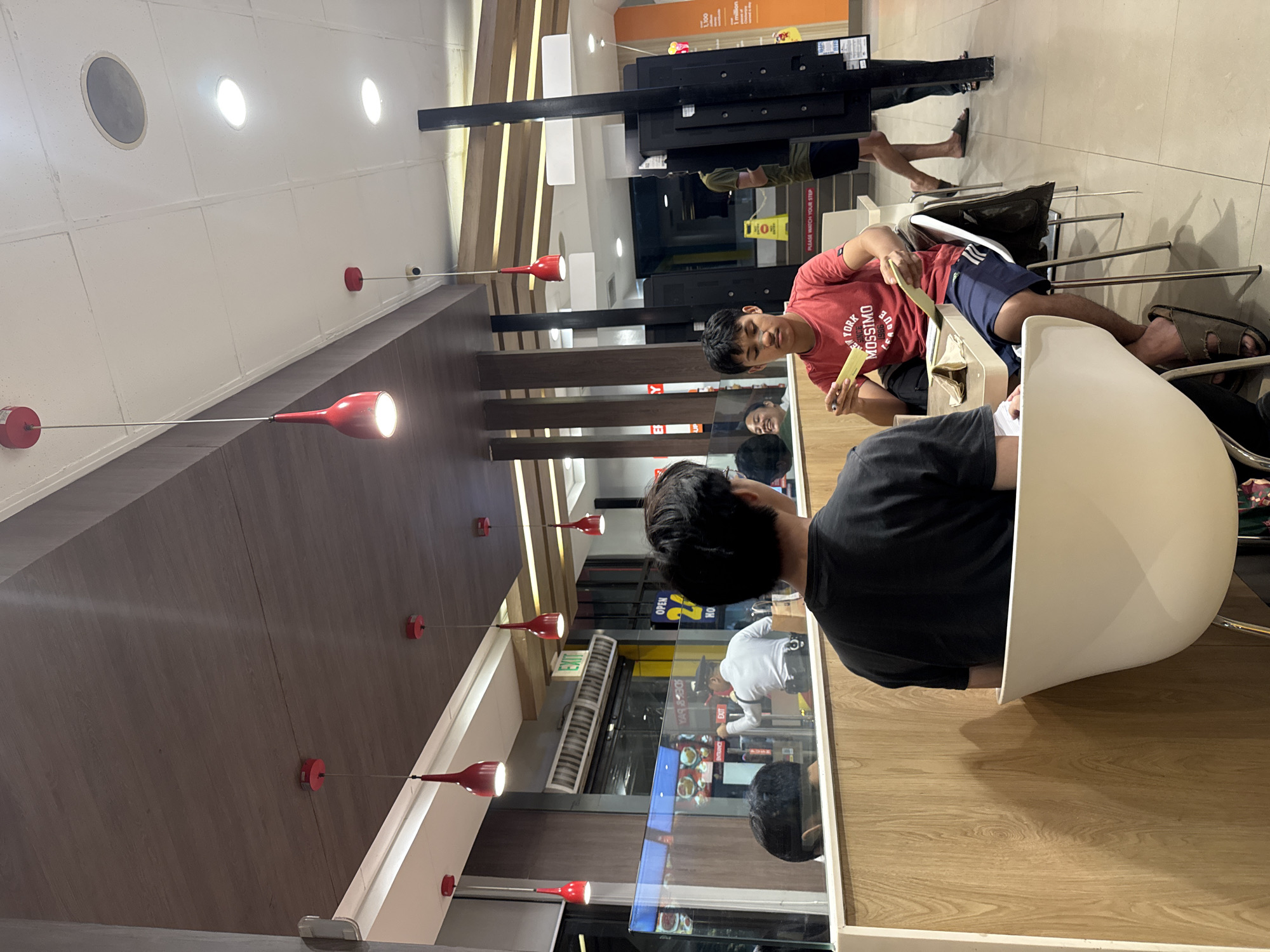 Lunch crowd documented at Jollibee restaurant in Davao City