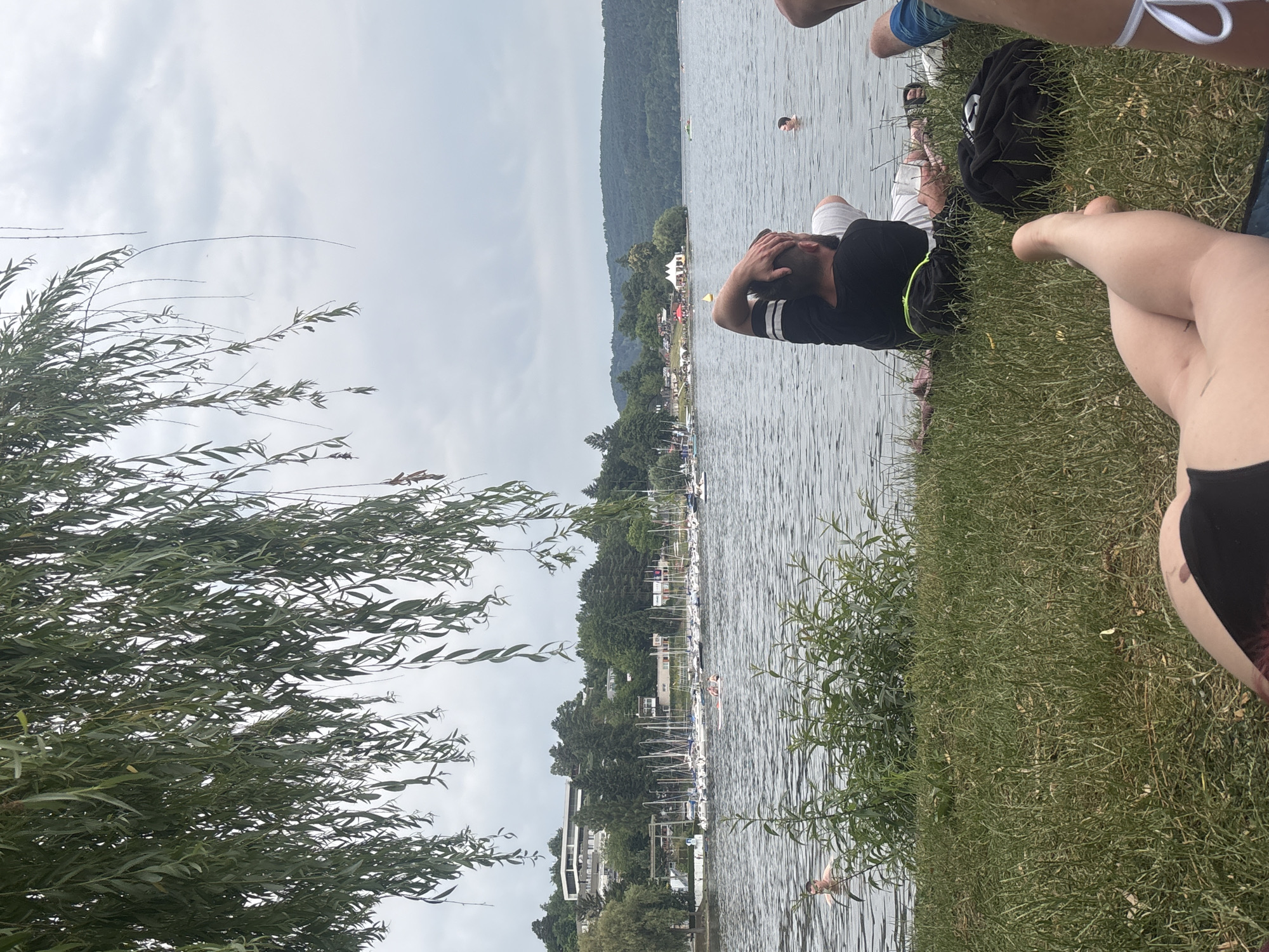 Lazy lakeside afternoon with swimming, sunbathing, and a pedal boat.
