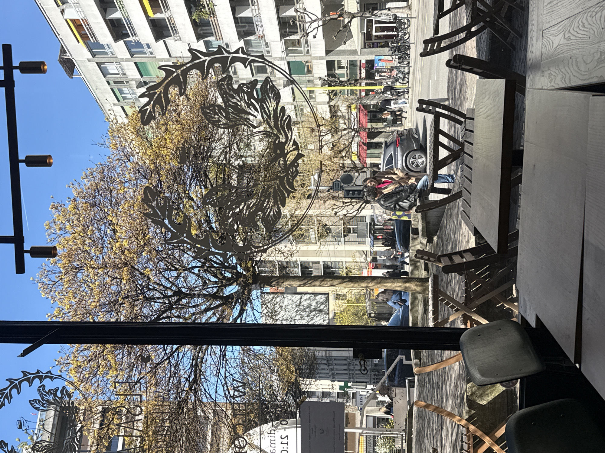 Woman enjoys orange juice at Geneva café