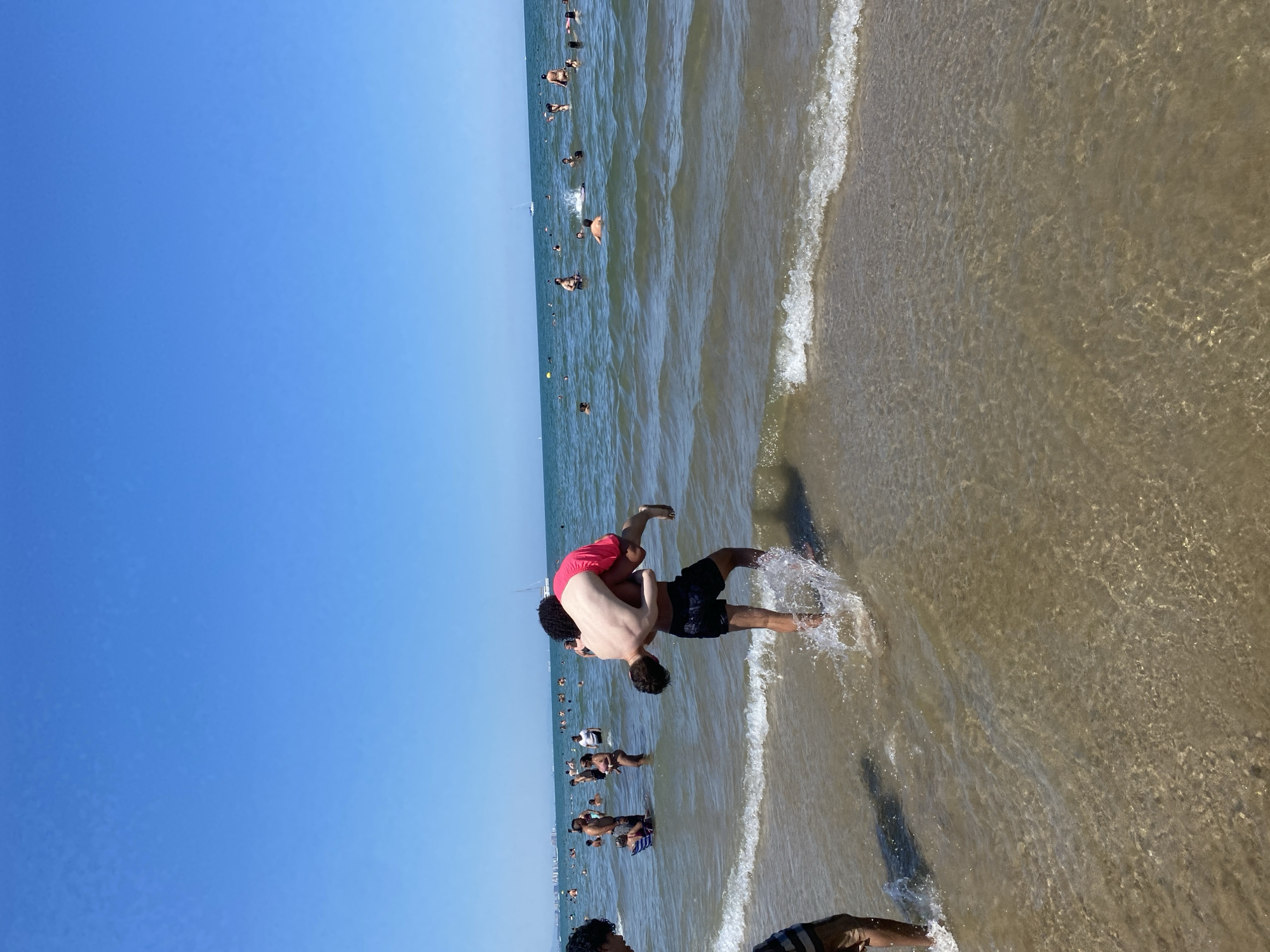 Packed summer afternoon on Valencia's sunny beachfront