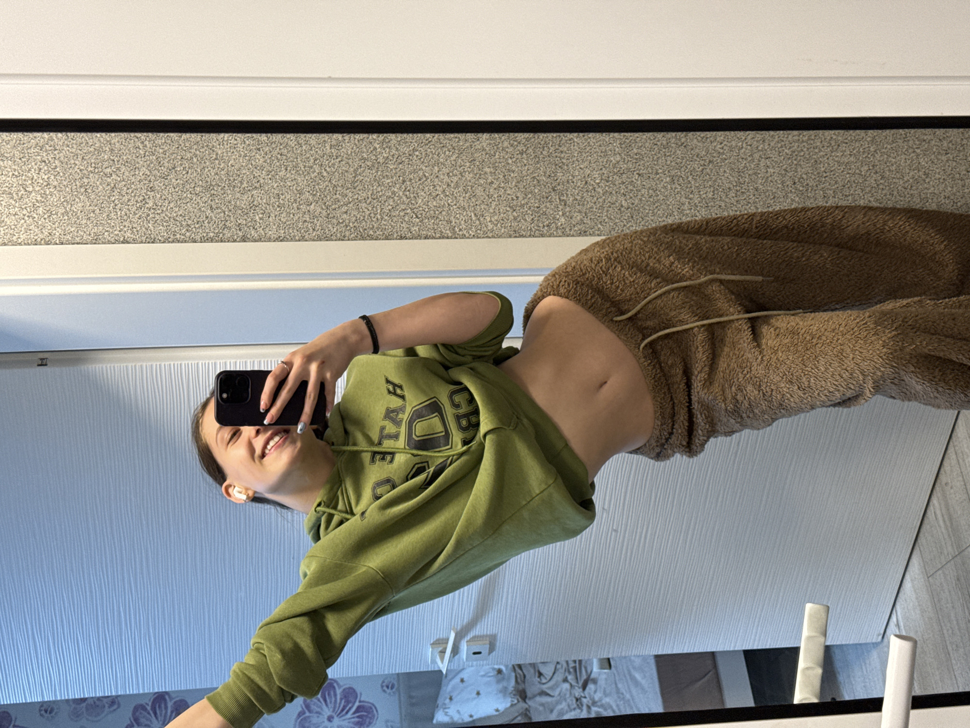 Woman takes mirror selfies in Sofia bathroom