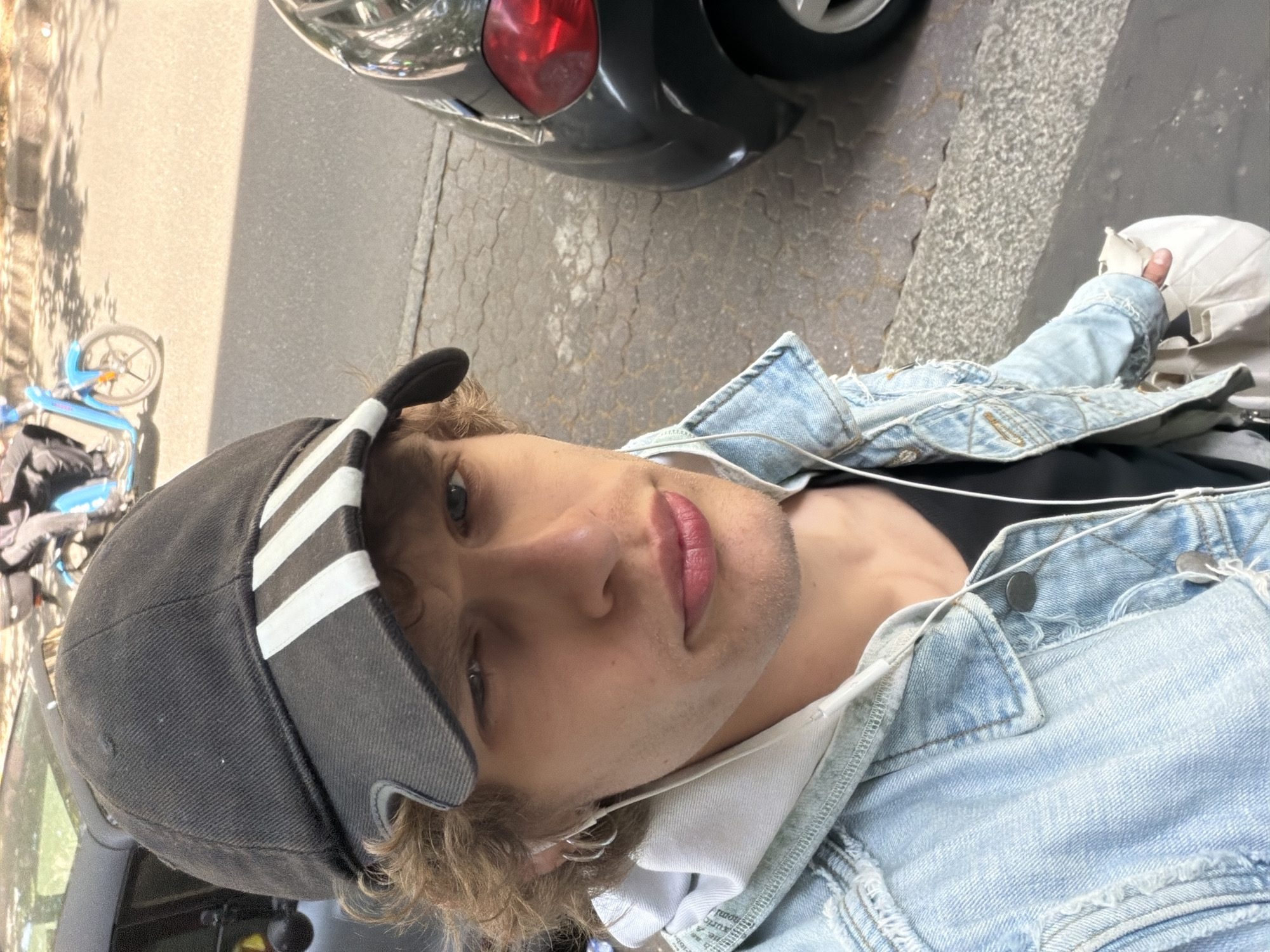 Young man in denim jacket observed in Milan