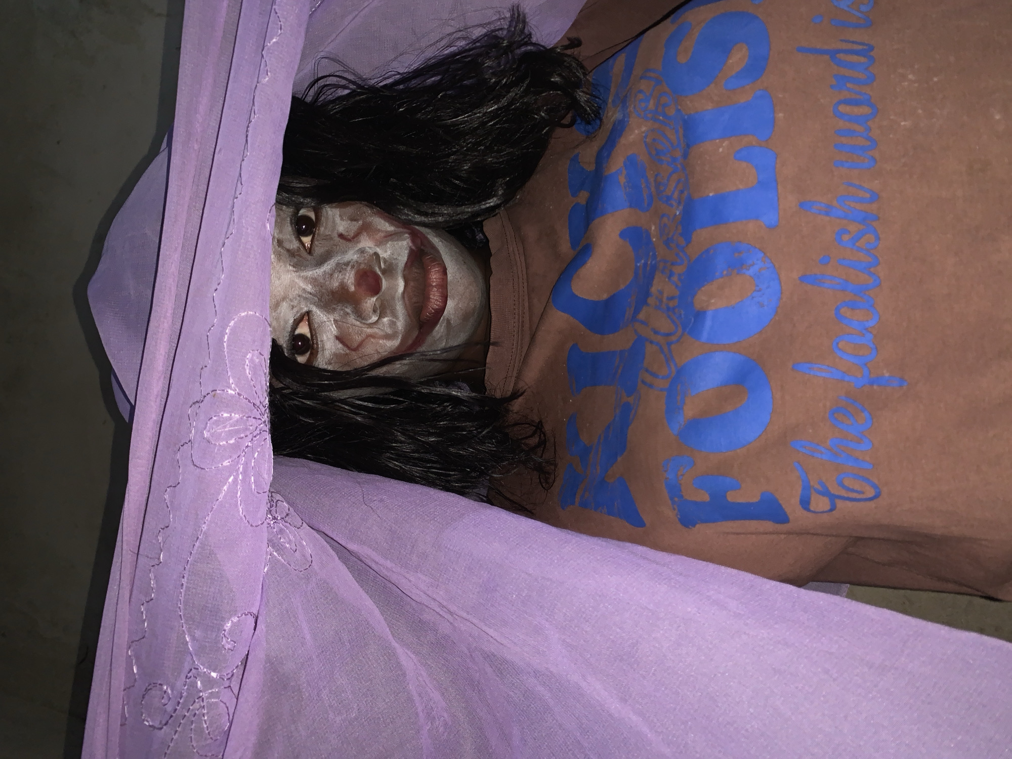 Person with face paint observed on ground in Agban