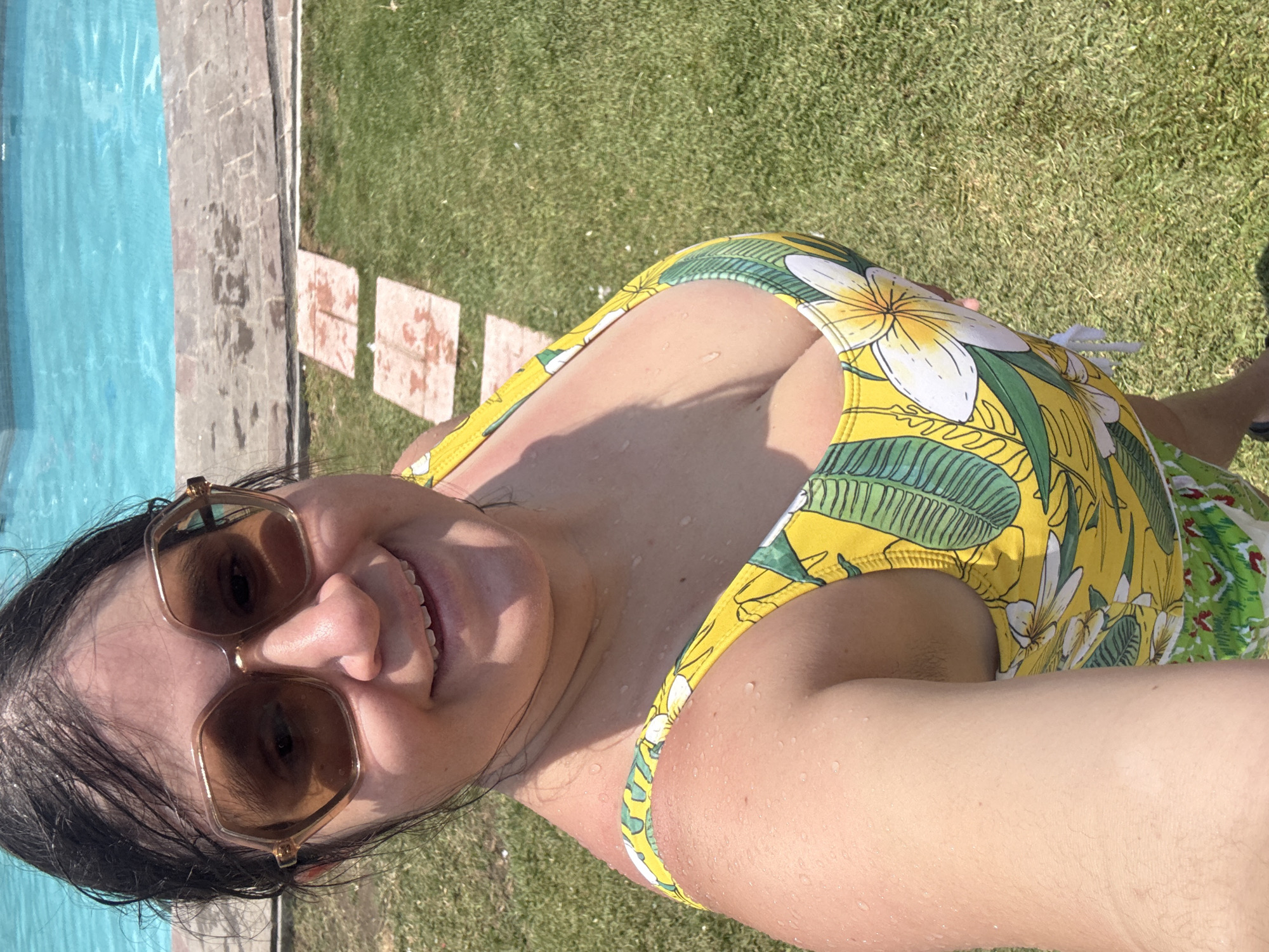 Woman enjoys poolside selfies in Tres de Mayo, Mexico