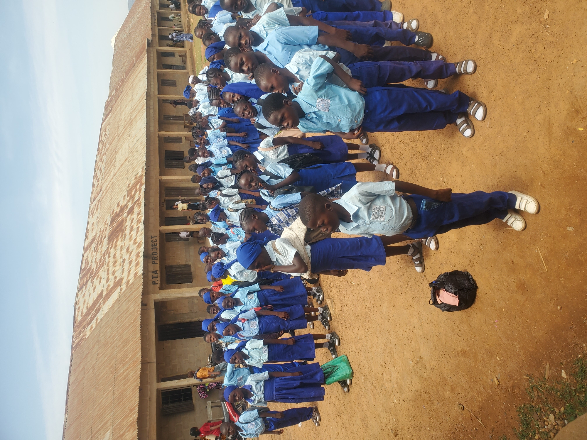 School children assemble in uniforms at Akwanga Nigeria schoolyard