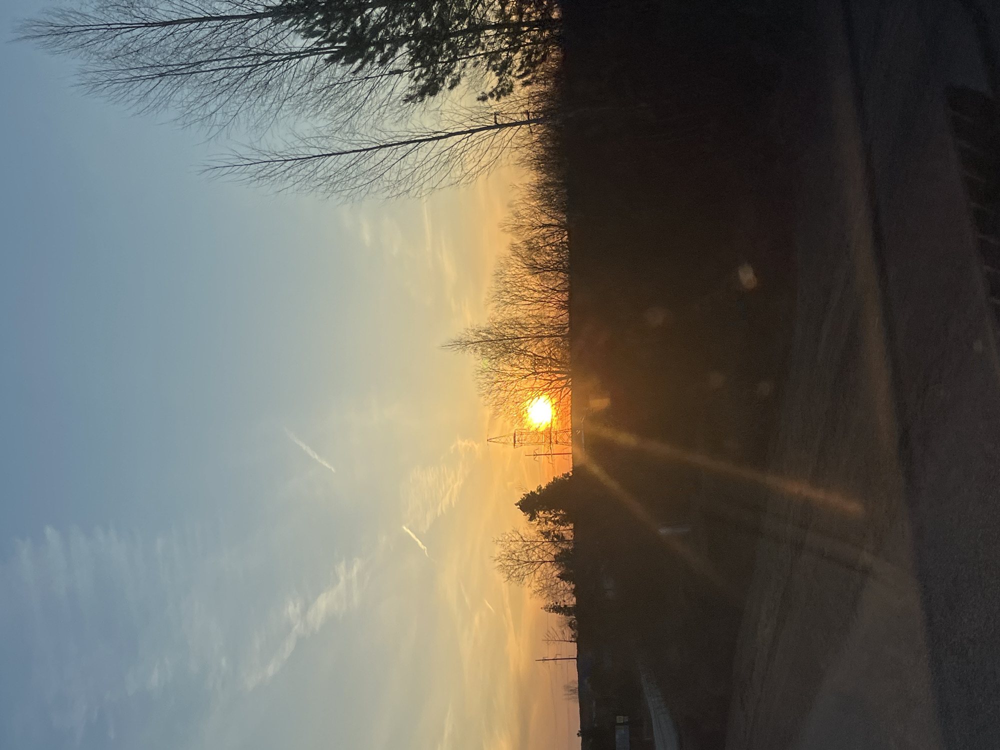 Sunset photographed between utility poles in Foki, Russia