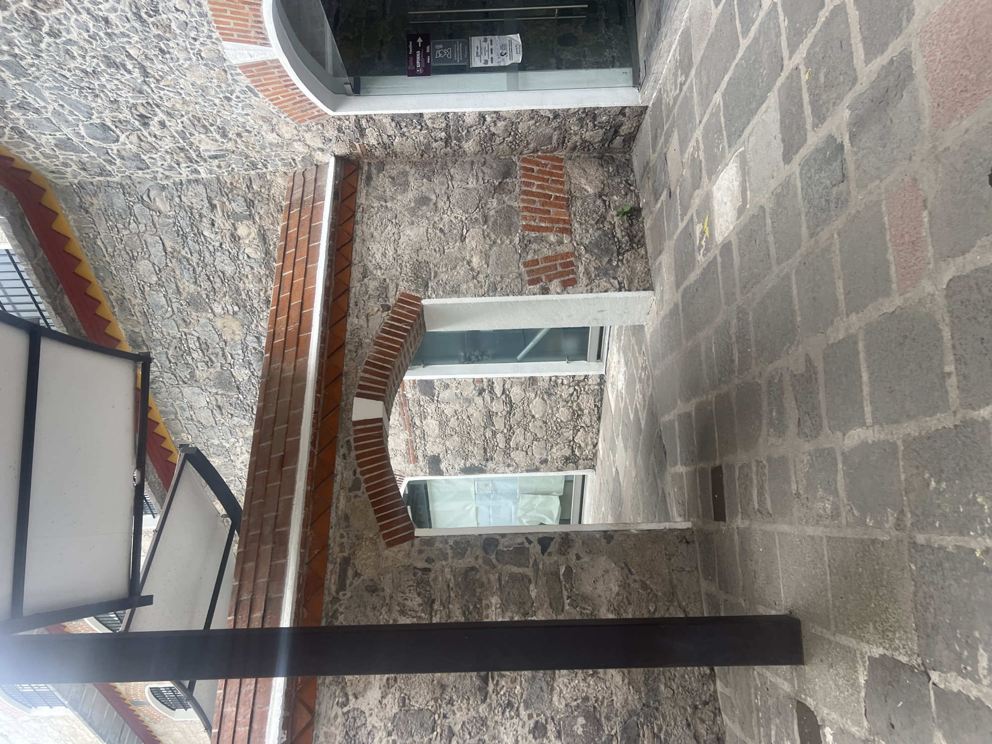 Stone passageway with brick arches documented in Puebla