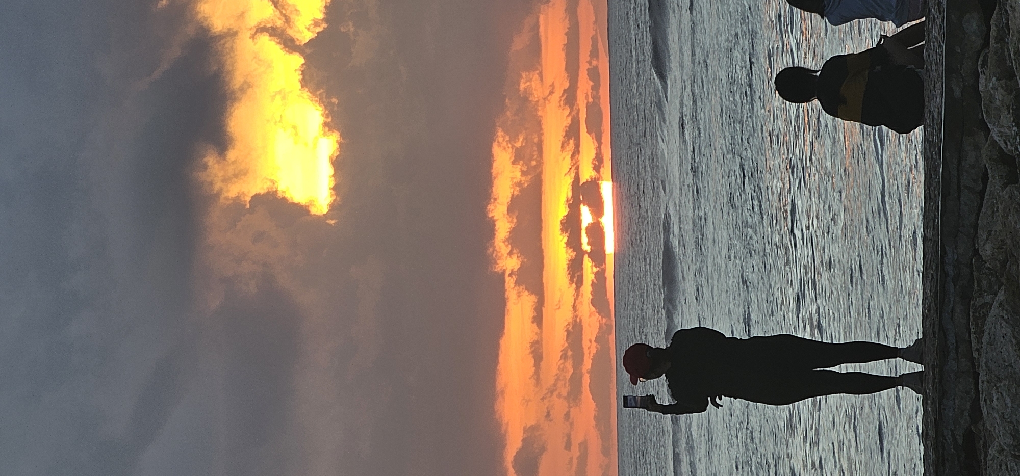 Sunset watchers gather along Denpasar beaches during golden hour