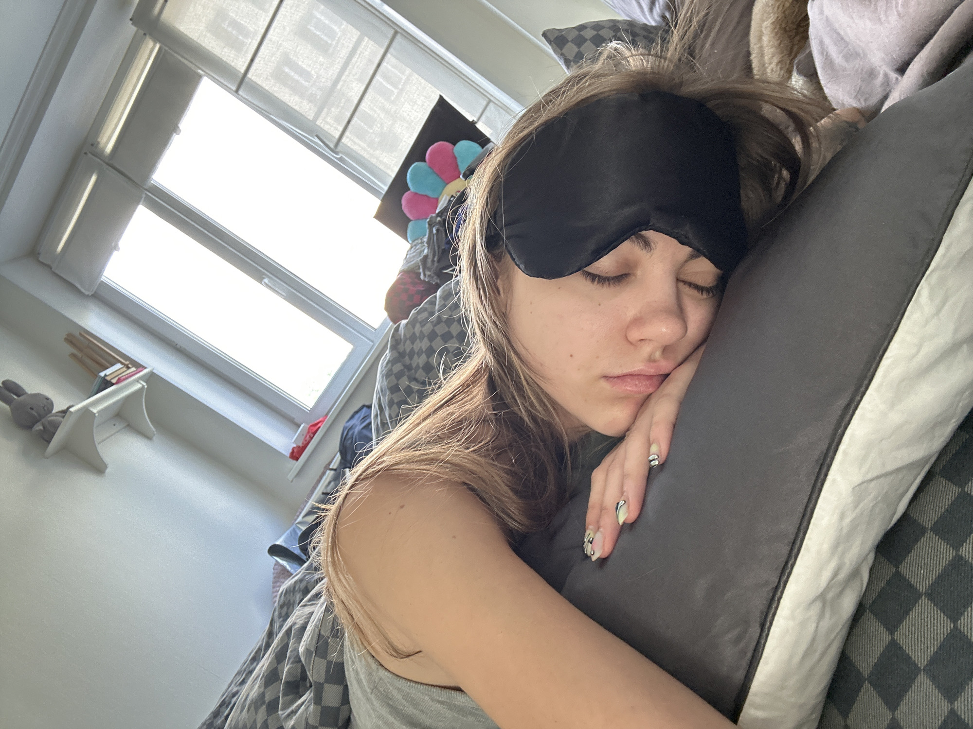 Woman awakens in Moscow bedroom during morning hours
