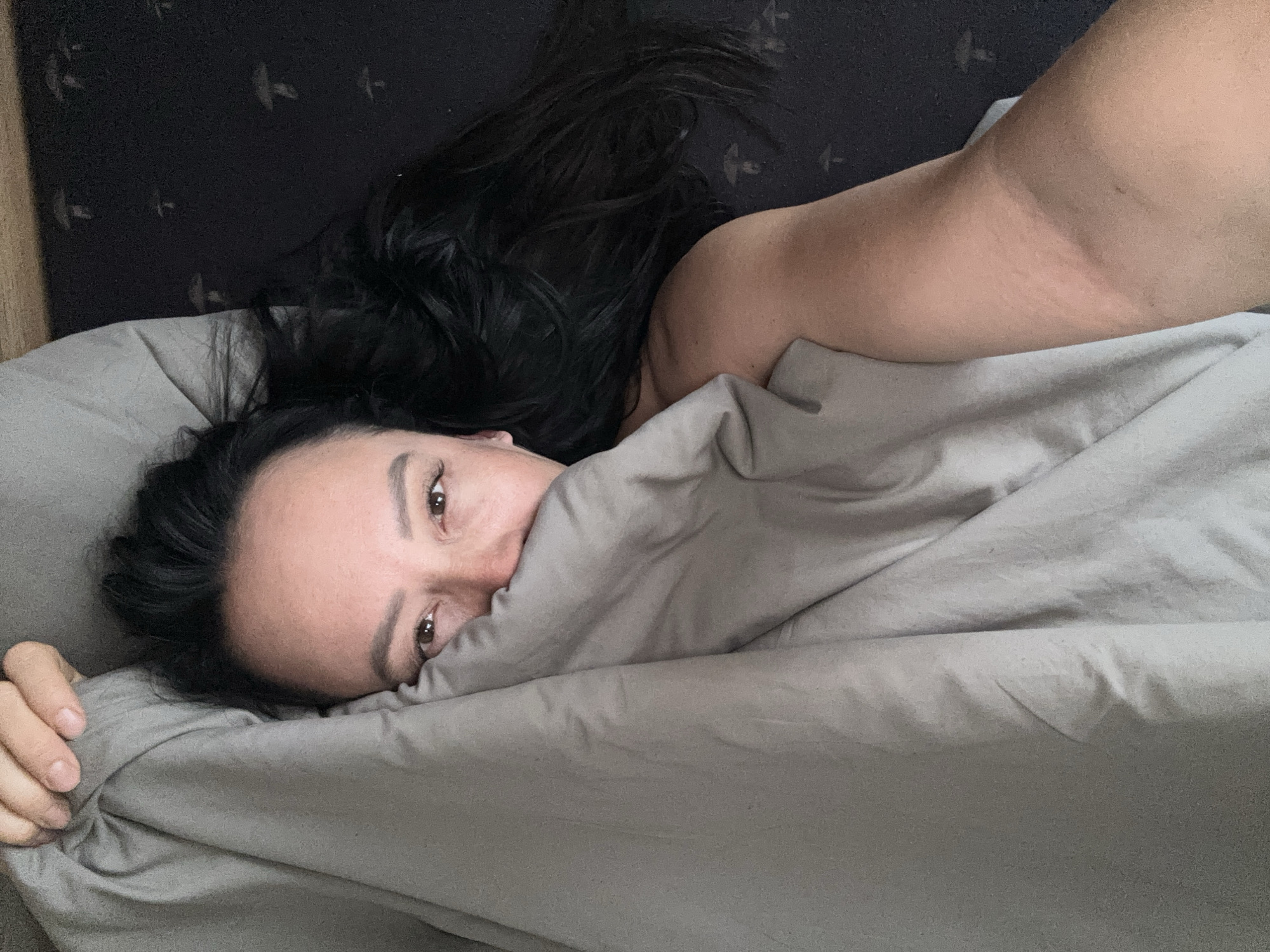 Woman in bed observed in Chaikovsky, Russia early morning