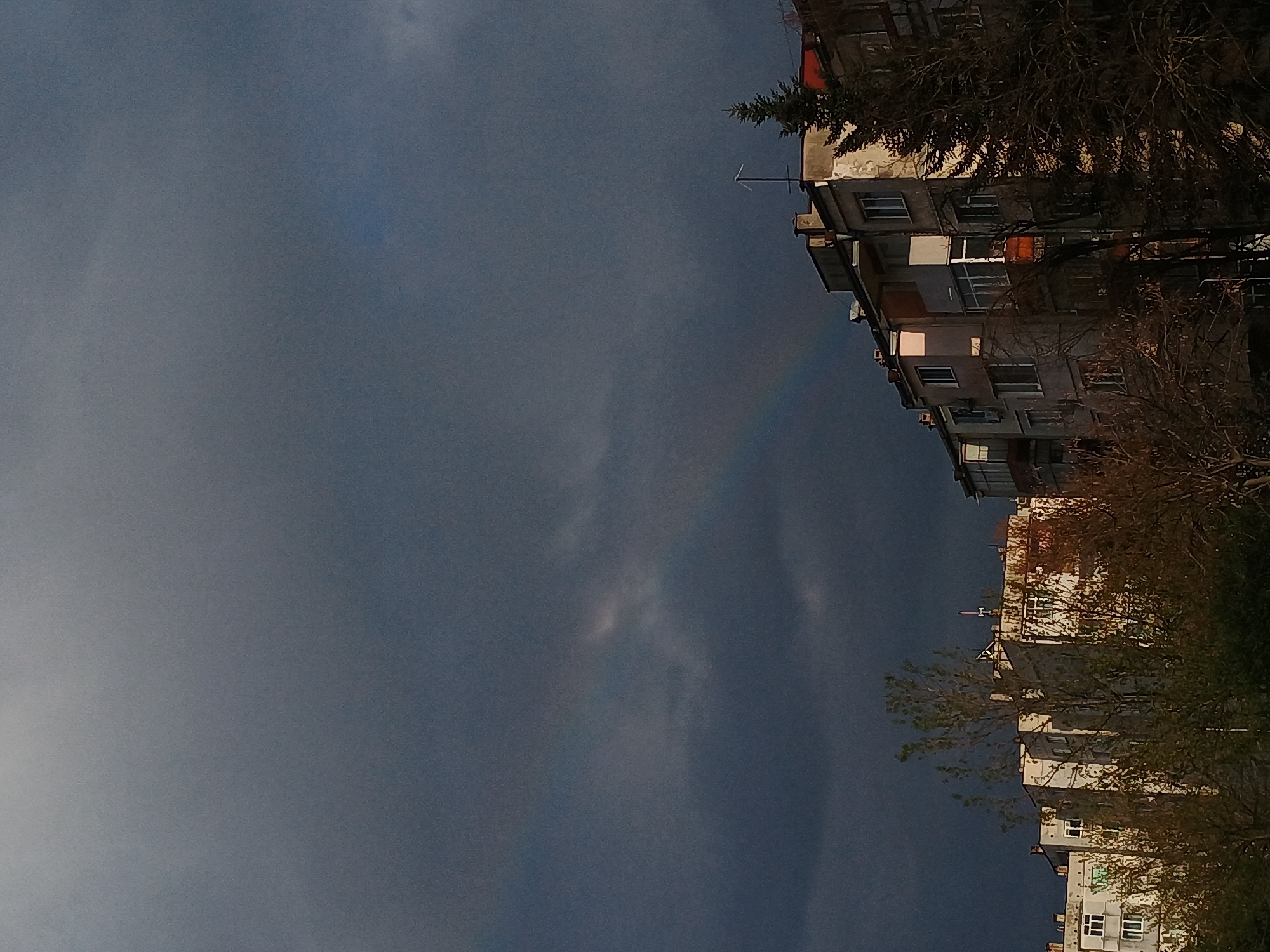 Faint rainbow appears over Veliko Tarnovo apartment buildings
