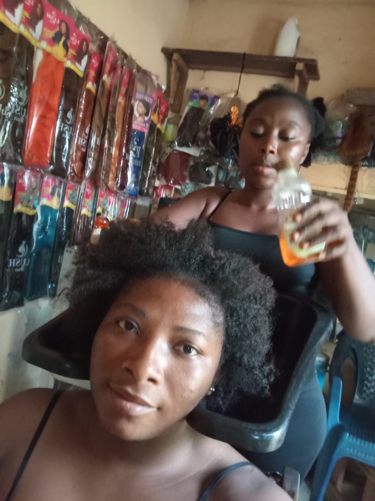 Daily life unfolds in Nigerian streets and salons