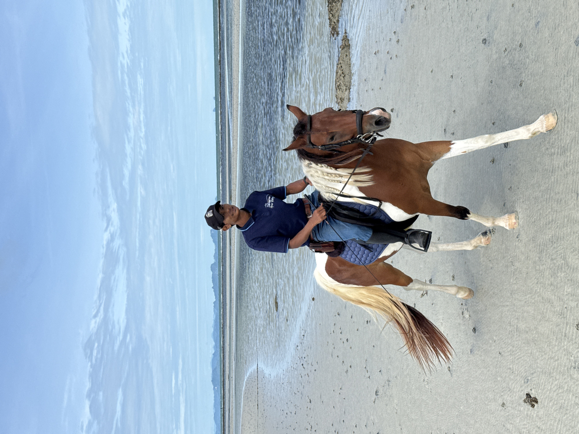 Horseback riding along Ko Samui's overcast shoreline