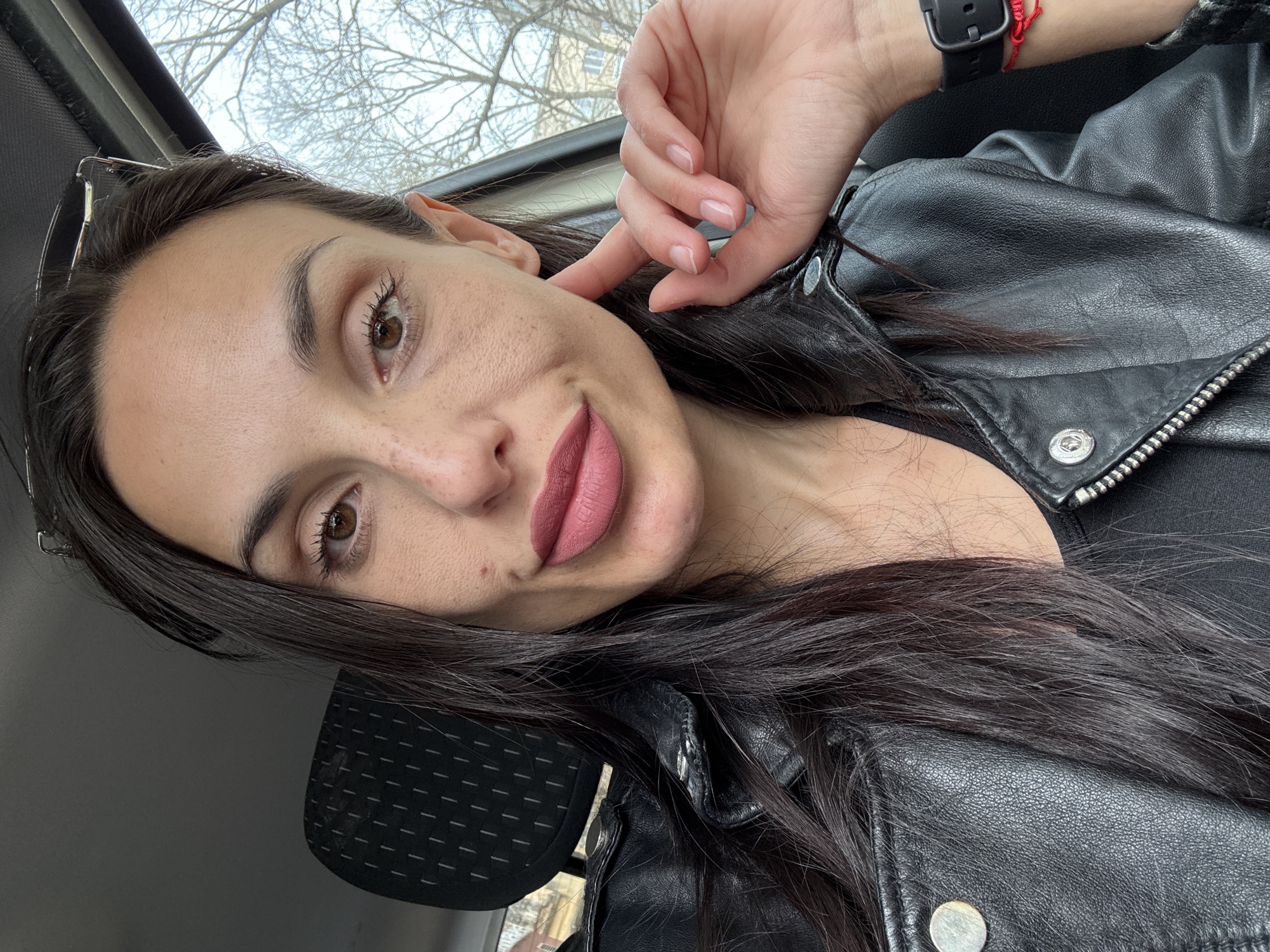 Woman takes selfie in black leather jacket in Pleven