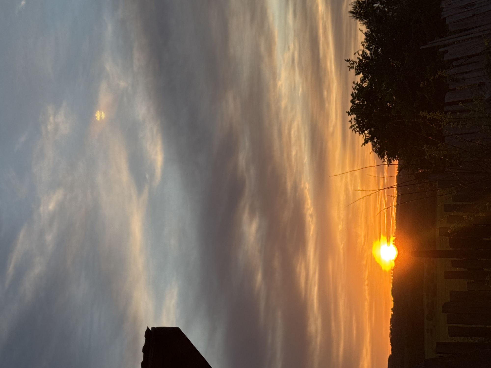 Woman documents sunset moment in rural Russian village