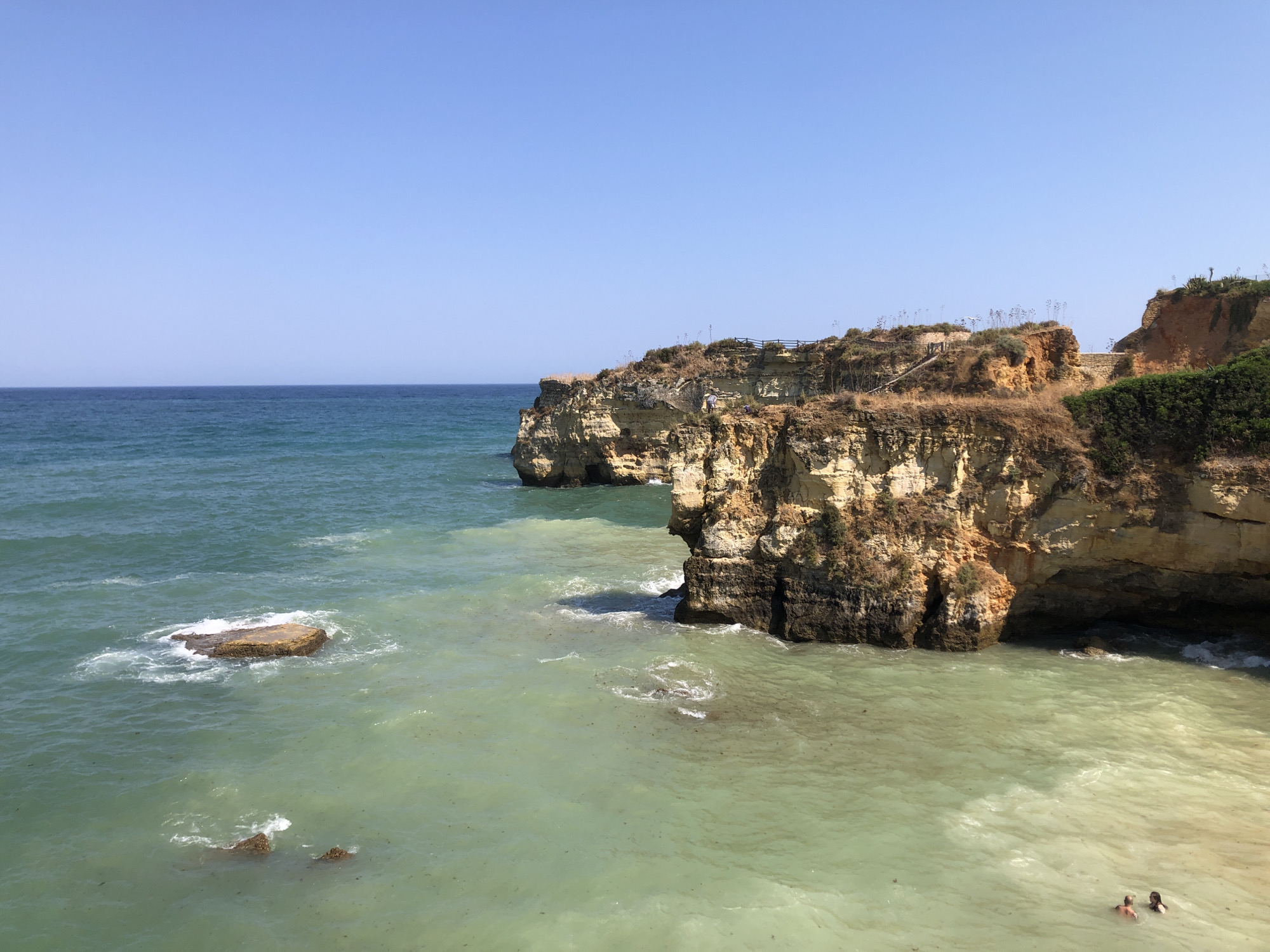 Turquoise water and rocky cliffs along the Lagos coastline