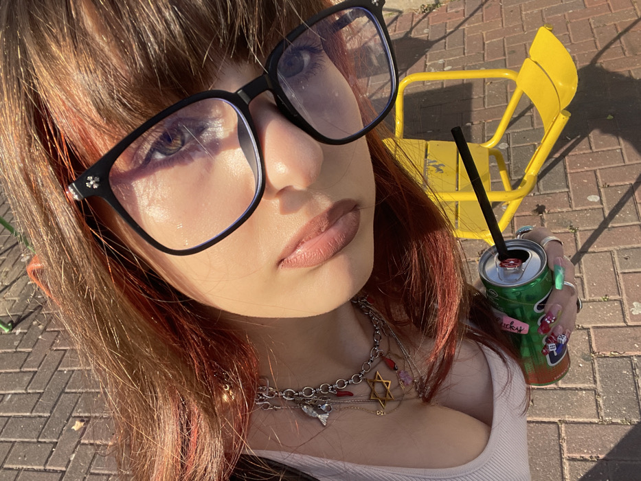 Woman documents afternoon in Ra'anana through selfies and cityscape views