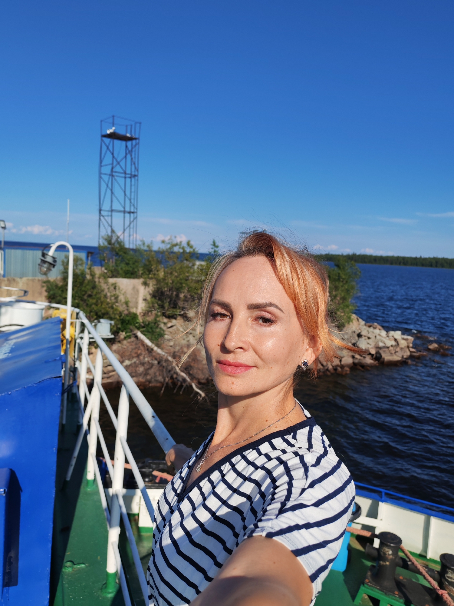 Ferry deck selfies and sunny waterway views in rural Russia