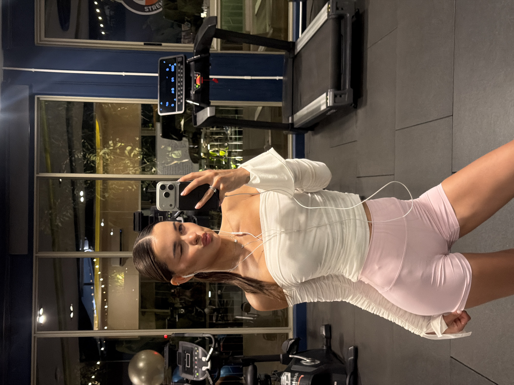 Woman takes gym selfies in Si Sunthon, Thailand