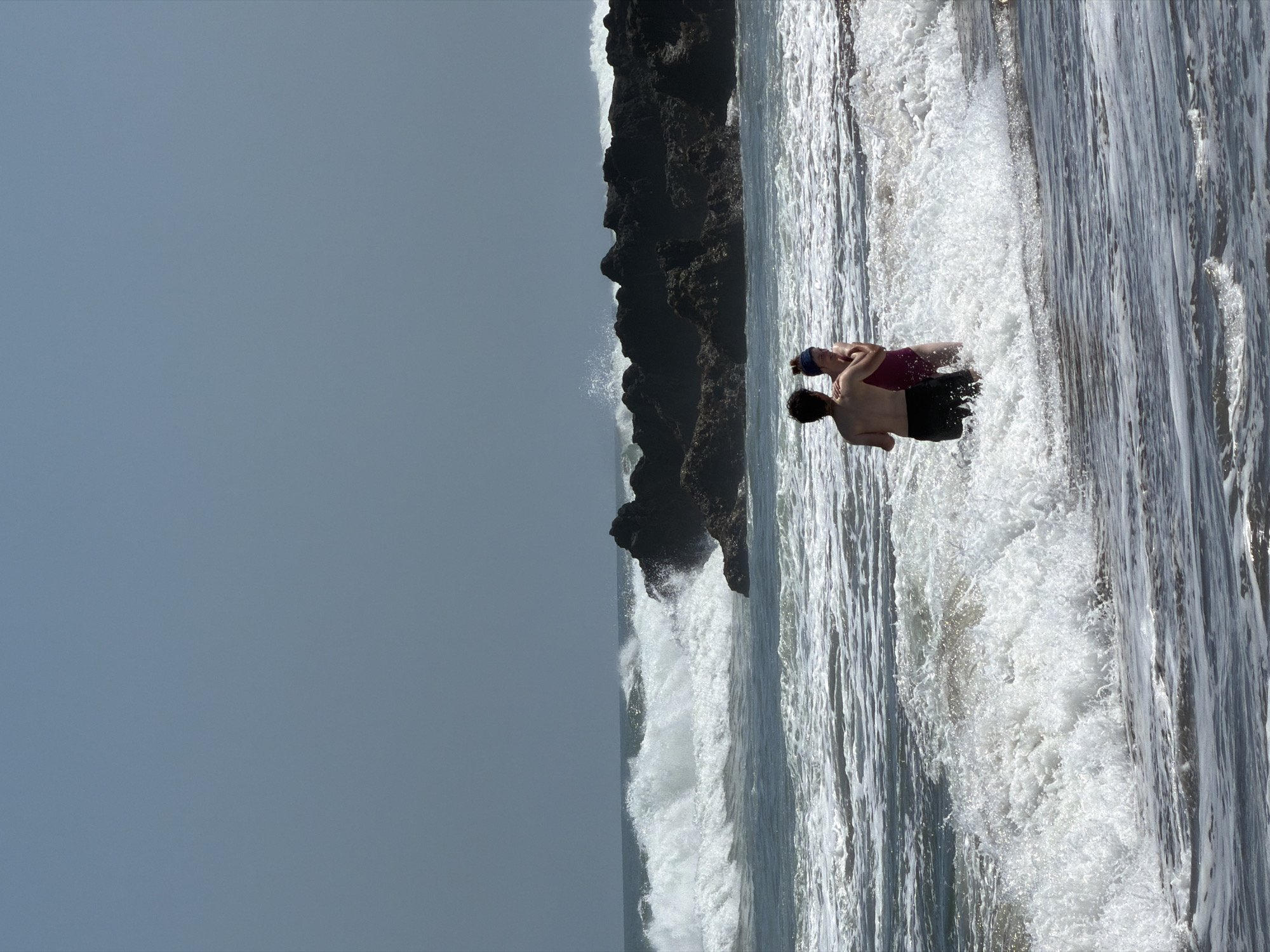Two people face off in the Bali surf at North Kuta