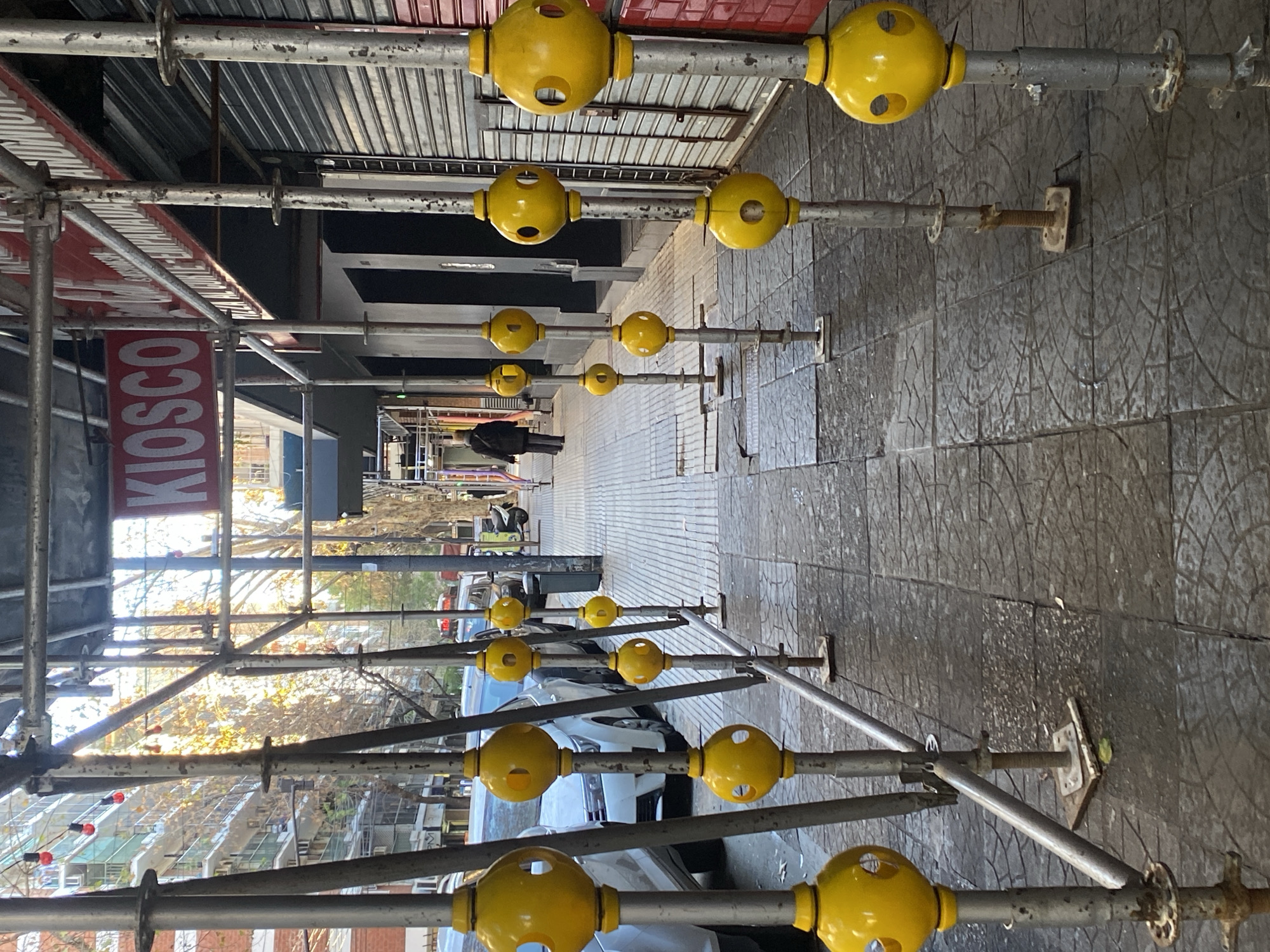 Street scene near scaffolding and apartments in Buenos Aires