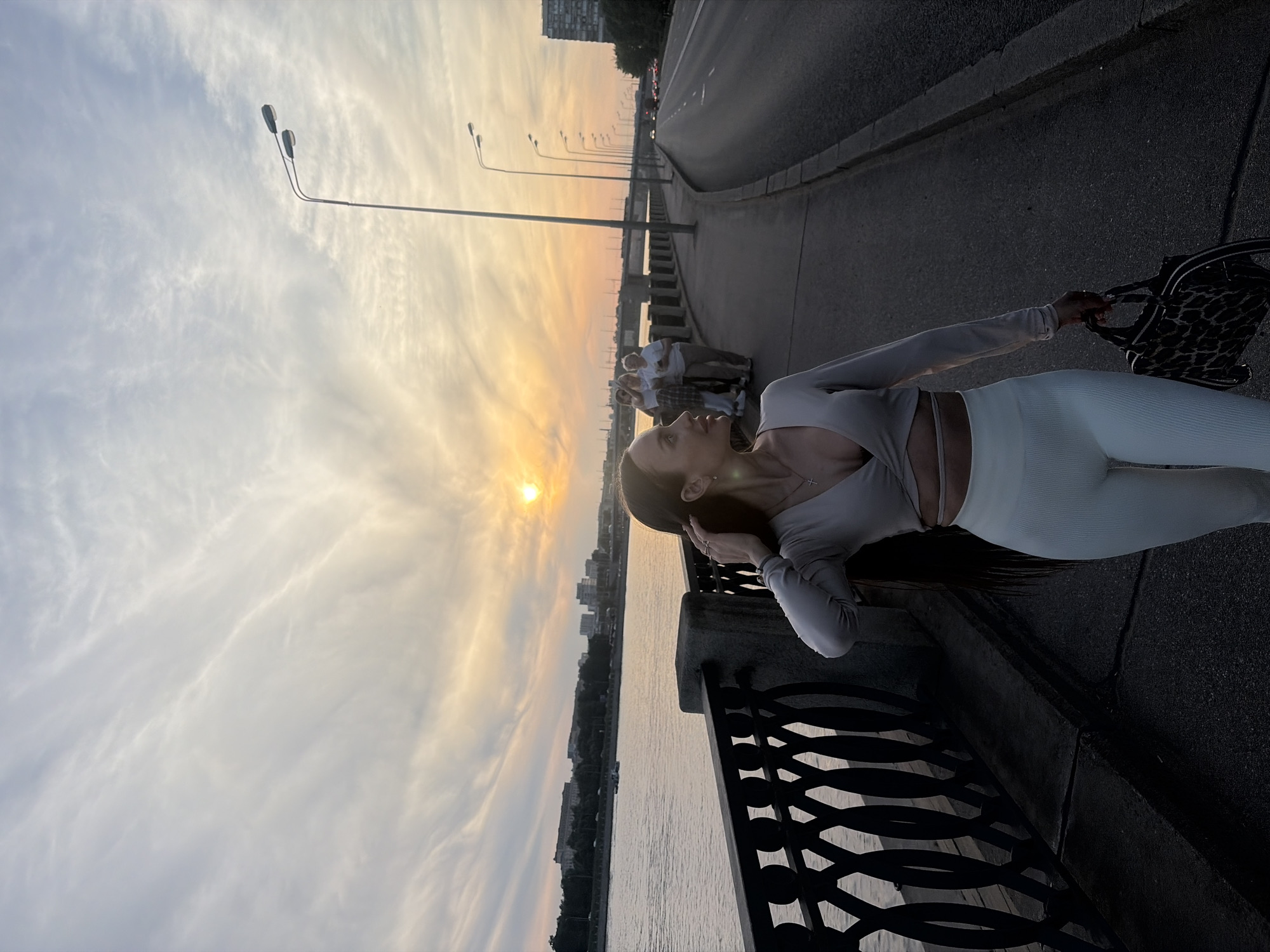 Evening scenes documented along Russian city riverside during sunset